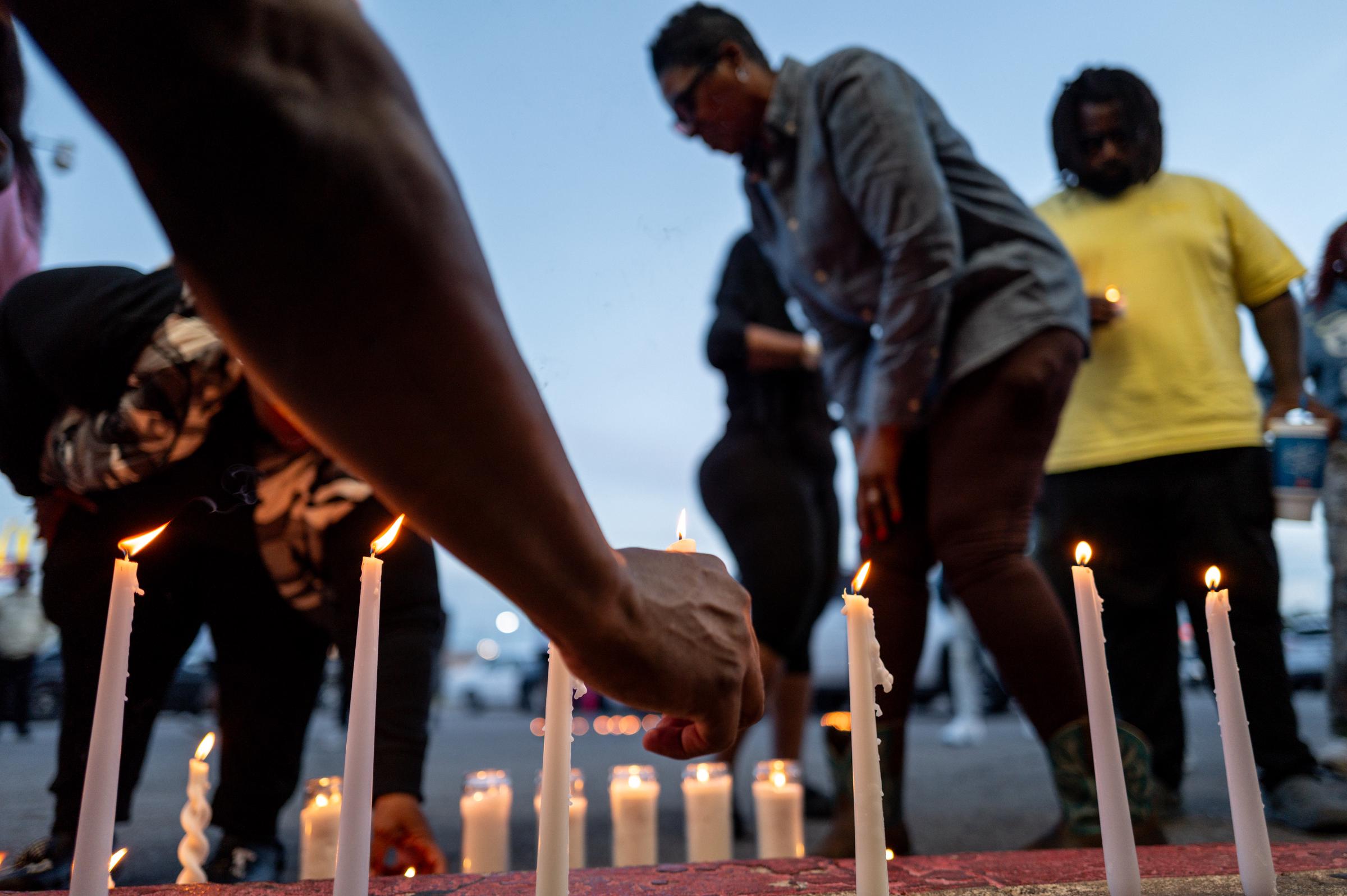 People light candles at a vigil in Shreveport, Louisiana | Source: Getty Images