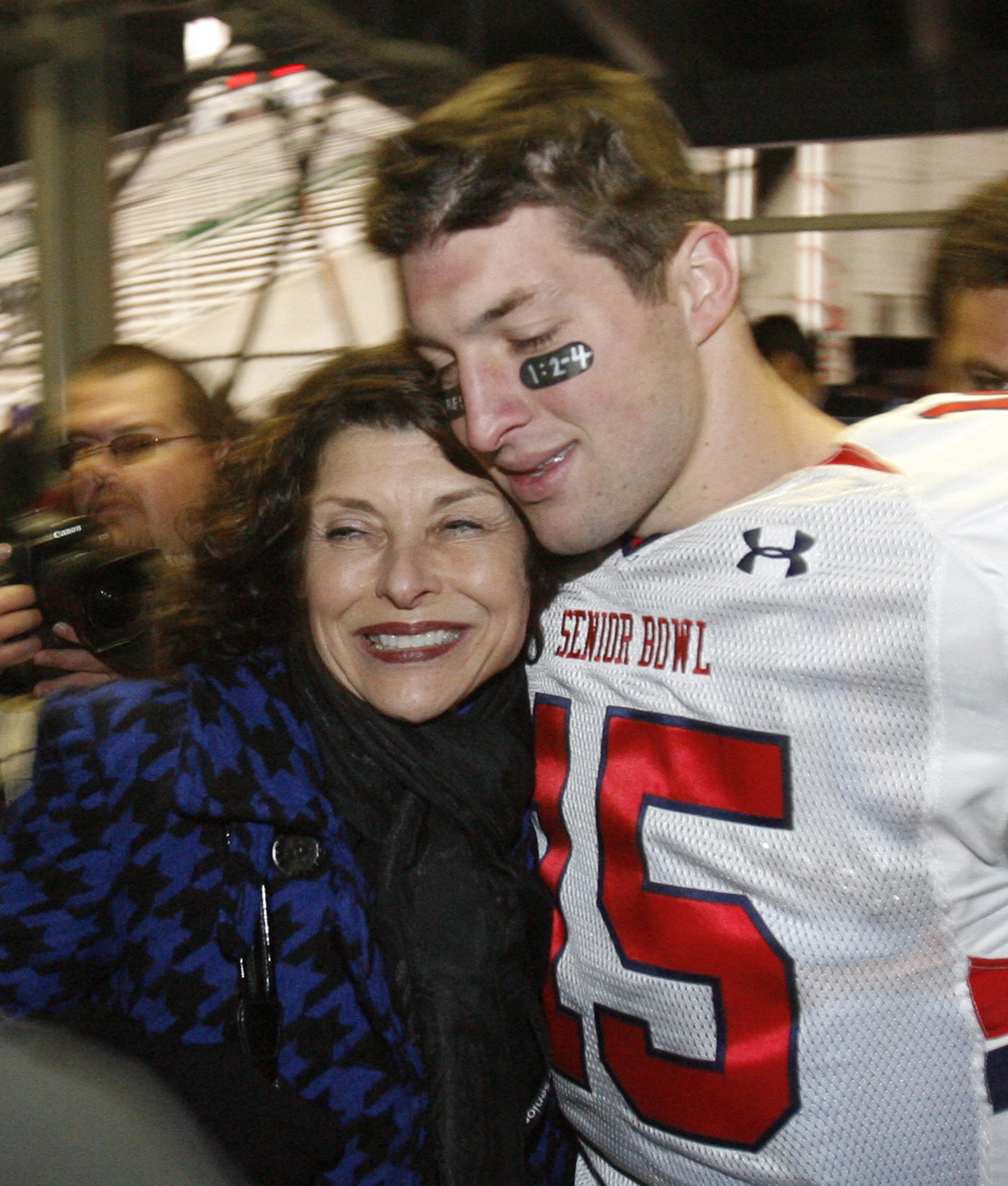 Former Florida quarterback Tim Tebow hugs his mother, Pam, following the Senior Bowl at Ladd-Peebles Stadium in Mobile, Alabama, Saturday, January 30, 2010. The North beat the South, 31-13. | Source: Getty Images