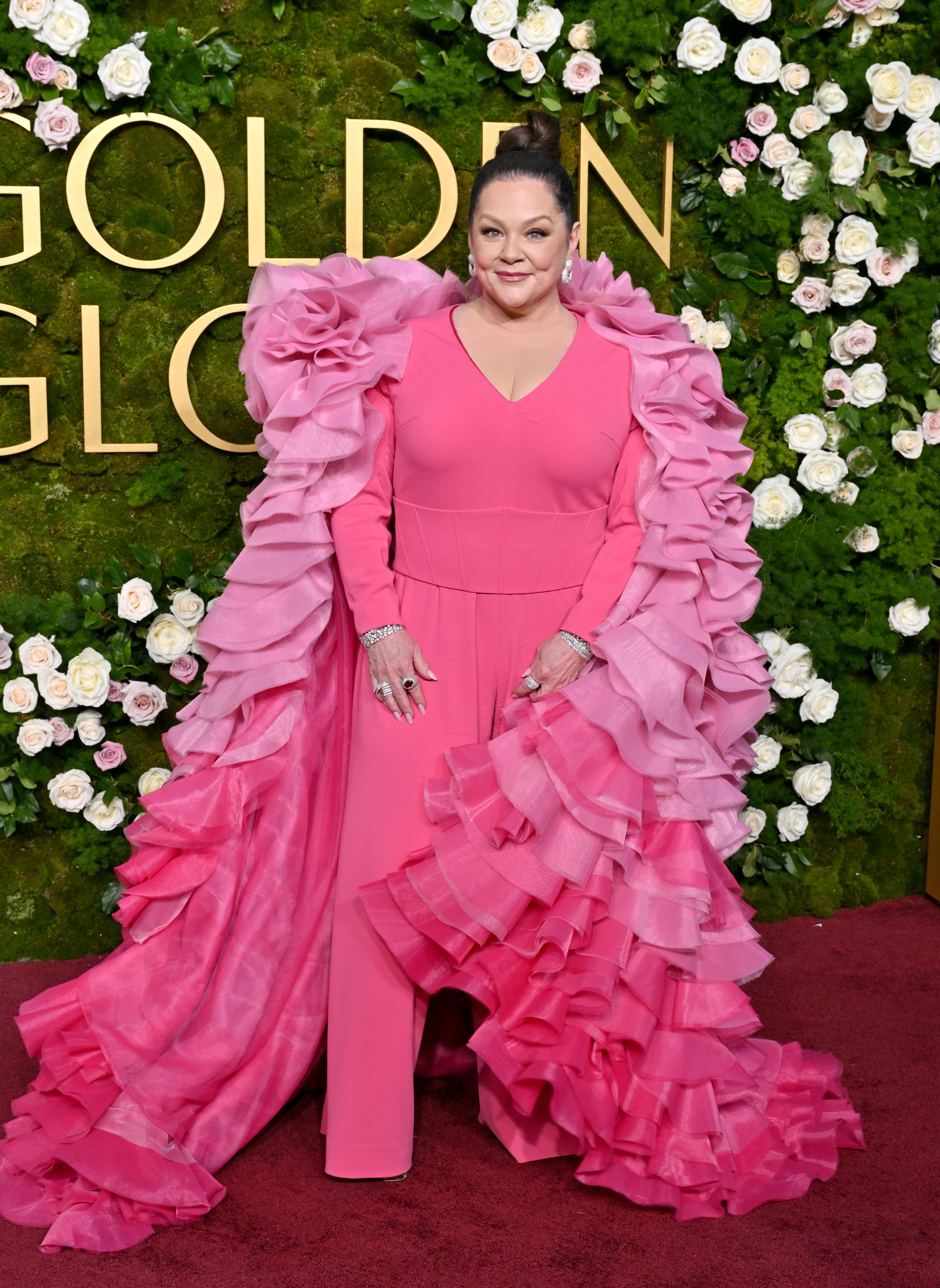 At the 82nd Golden Globe Awards, McCarthy turned heads in a bold pink look with dramatic ruffles, leaning fully into statement dressing and high-impact red carpet fashion.