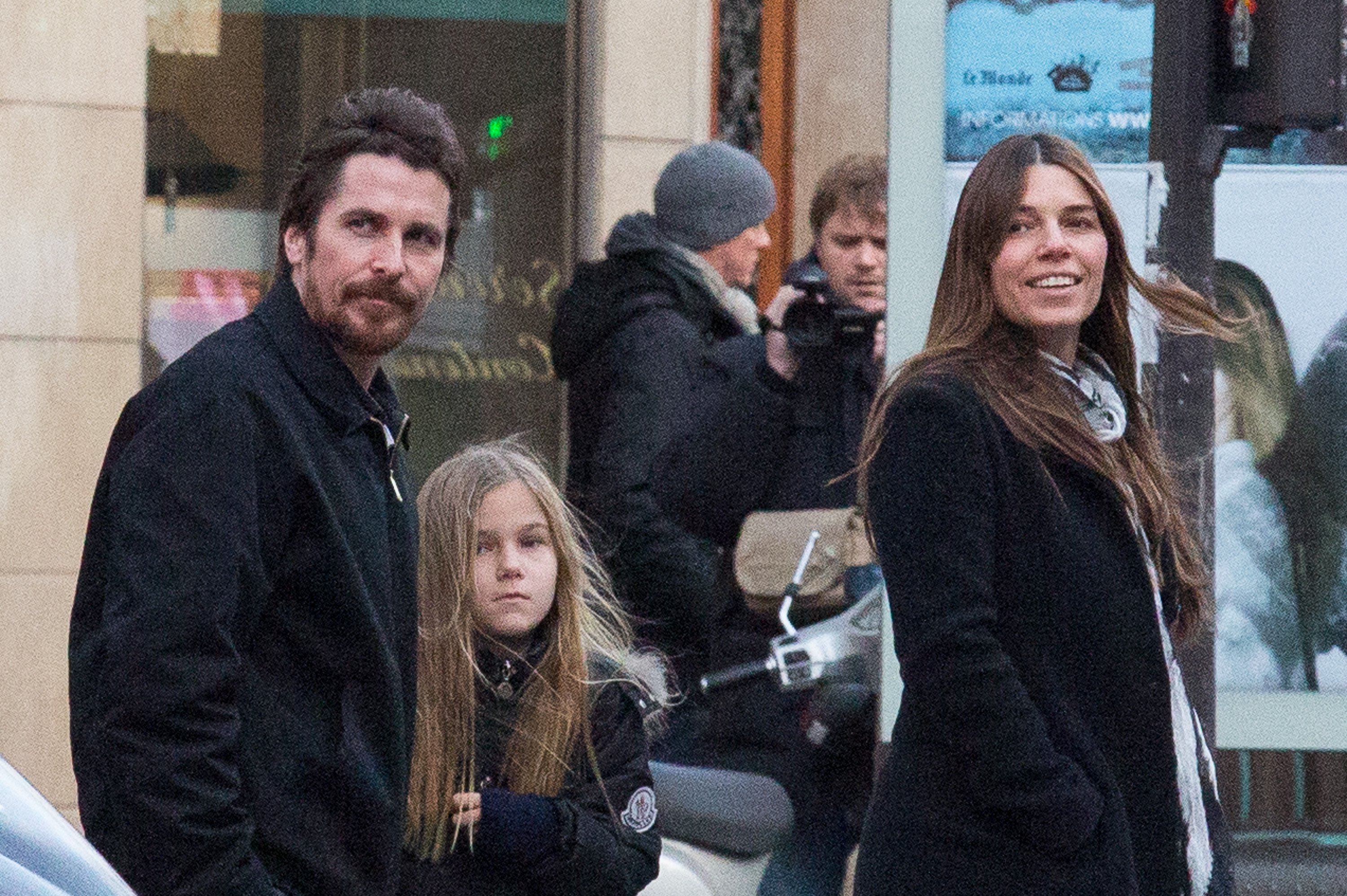 Christian Bale, his daughter Emmeline Bale, and wife Sibi Blažić at the Saint-Germain-des-Pres quarter in Paris, France, on January 27, 2014 | Source: Getty Images