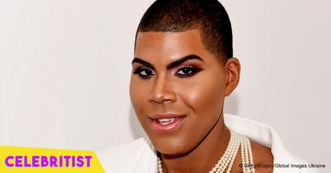 EJ Johnson flaunts his toned legs & bare chest in black sequined mini dress & high-heeled boots 