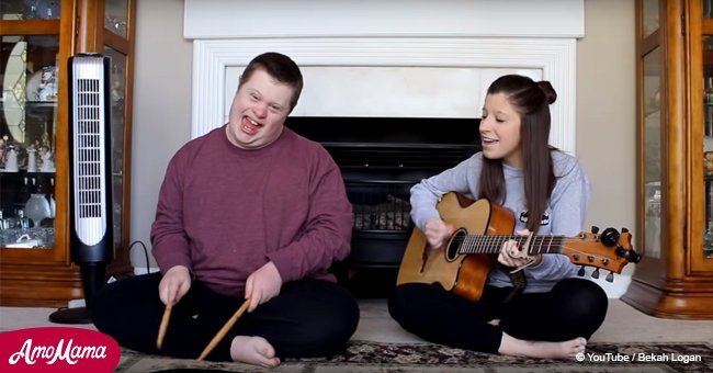 Boy with Down syndrome joins sister for touching duet of Dolly Parton song