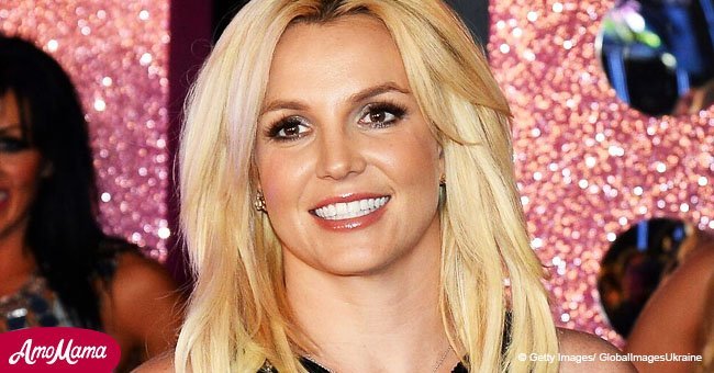 Britney Spears flaunts her toned midriff and slender legs while rocking a pair of skimpy shorts