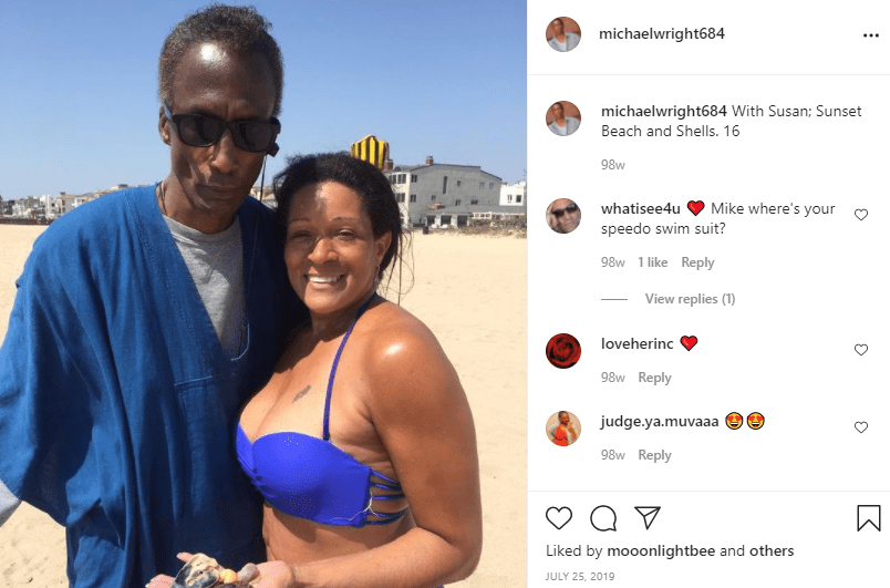 Michael Wright posing side by side with his lover at a beach | Photo: Instagram/michaelwright684
