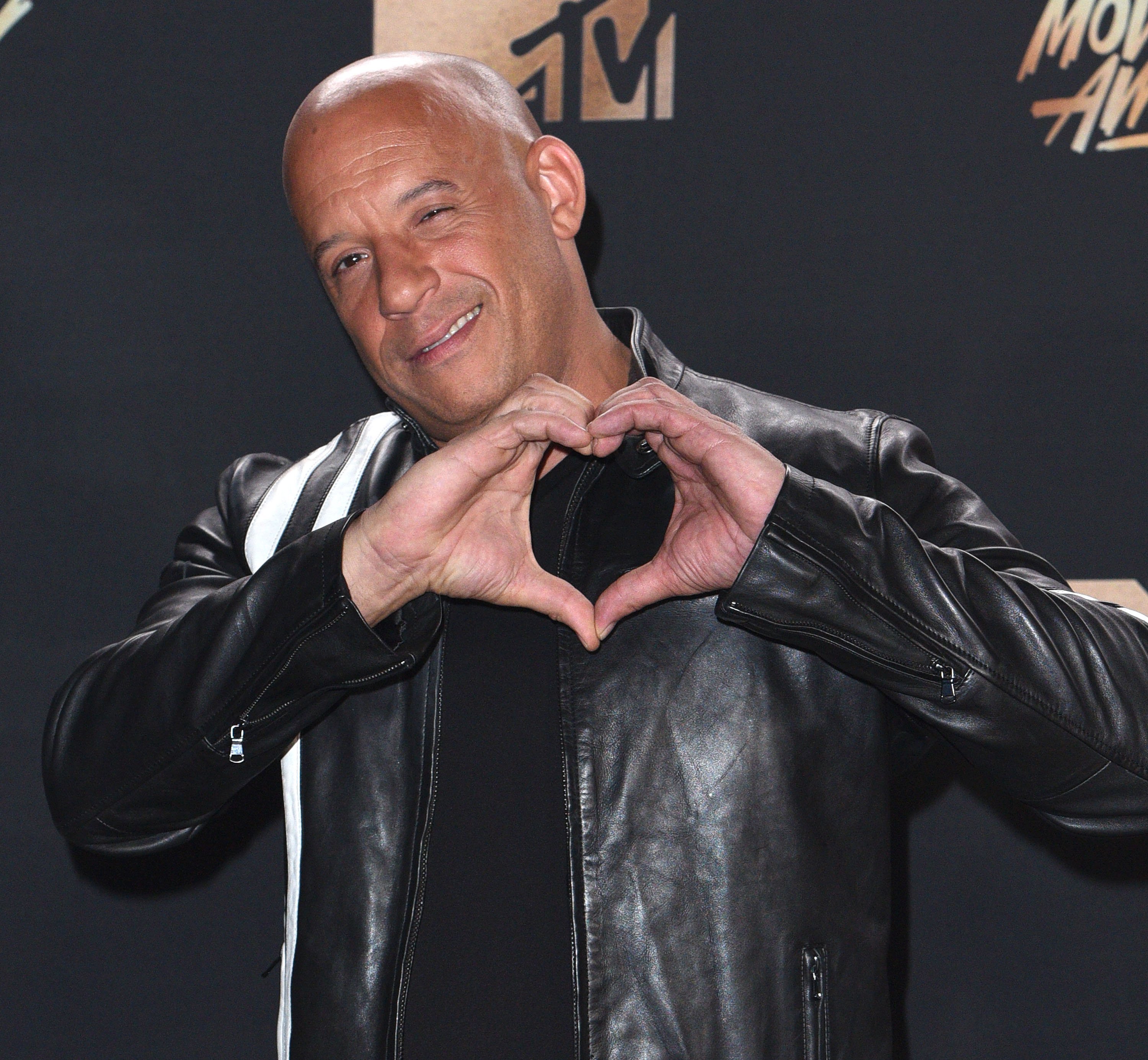 Vin Diesel poses in the press room at the 2017 MTV Movie and TV Awards at The Shrine Auditorium on May 7, 2017, in Los Angeles, California. | Source: Getty Images.