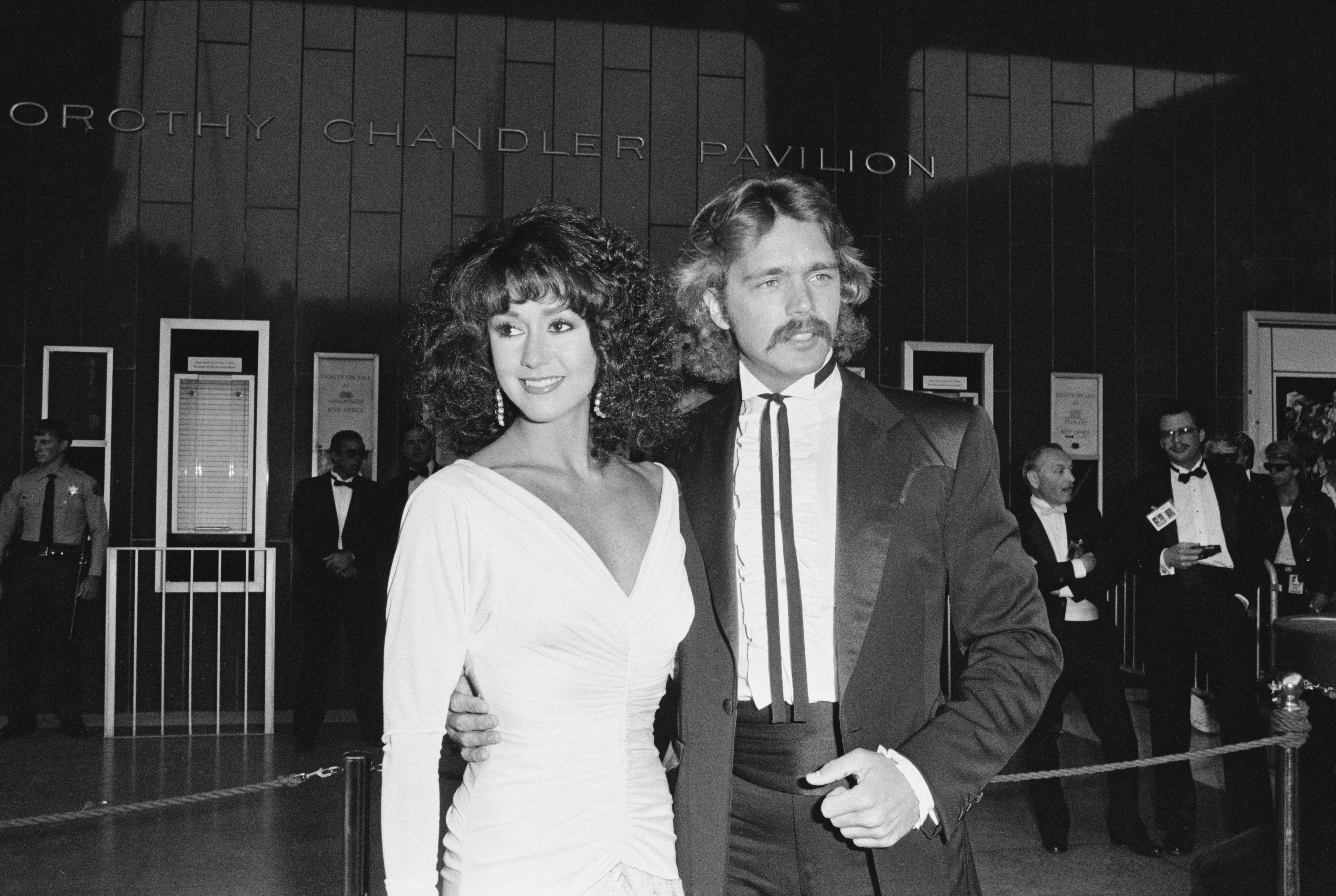 Tawny Little and Johnny Schneider during the 57th Academy Awards at the Dorothy Chandler Pavilion on  March 25, 1985, in Los Angeles, California. | Source: Getty Images