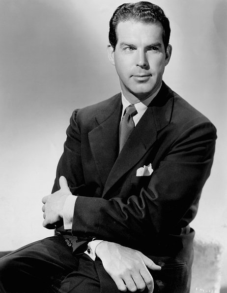 Publicity handout of actor and producer Fred MacMurray (1908-1991). MacMurray sits with his arms crossed over his lap and wears a dark suit and tie | Photo: Getty Images