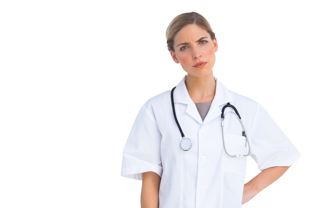 A photo of an upset and judgemental nurse. | Photo: Shutterstock.