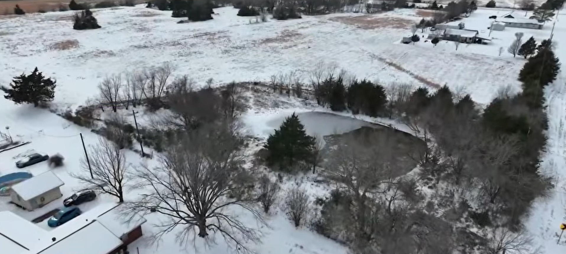 An aerial view of the icy pond, dated January 28, 2026 | Source: YouTube/@kwtxnews10