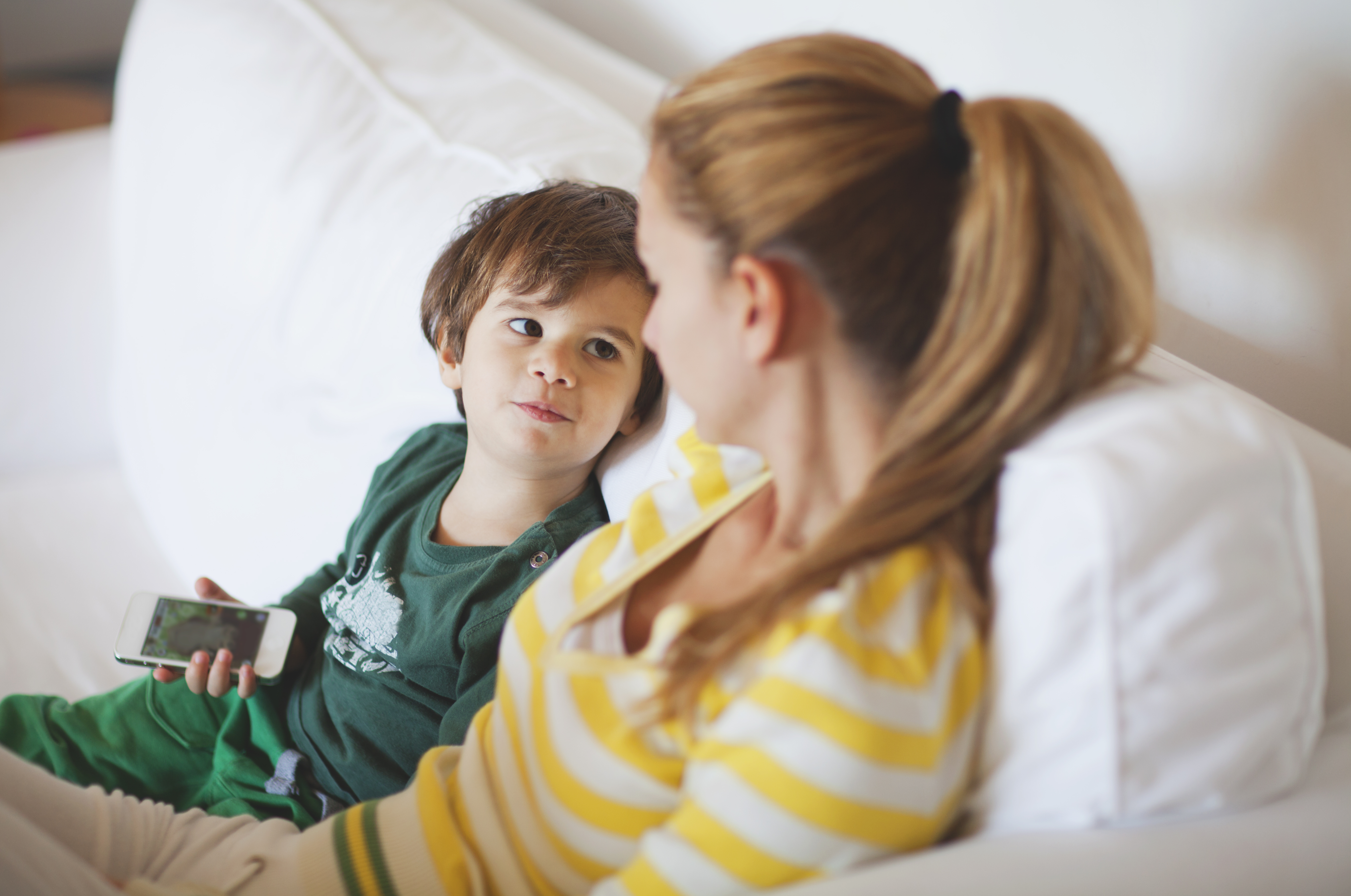 A young woman talking to a little boy | Source: Getty Images