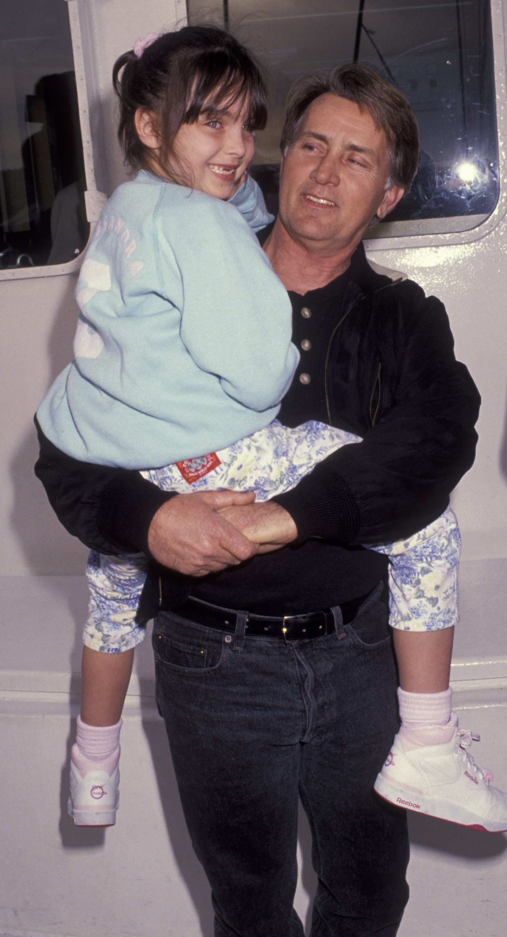 Actor Martin Sheen and granddaughter attend the Rainbow Warrior Launch Party aboard Rainbow Warrior on February 1, 1992, in San Pedro, California. | Source: Getty Images