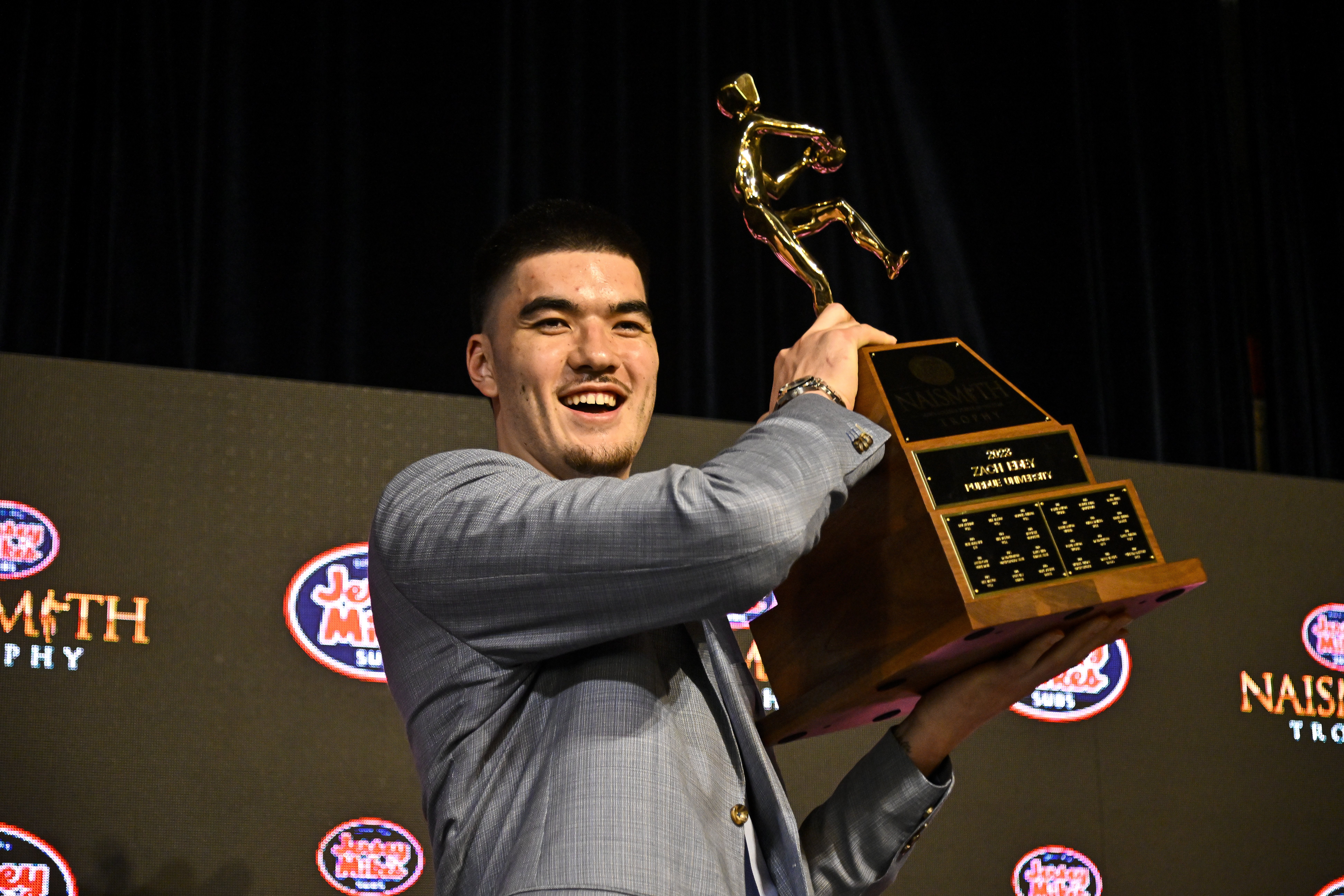Zach Edey is presented with the Naismith Men's College Player of the Year trophy during the 2023 Naismith Hall of Fame Brunch at The Ballroom at Bayou Place on April 2, 2023, in Houston, Texas. | Source: Getty Images