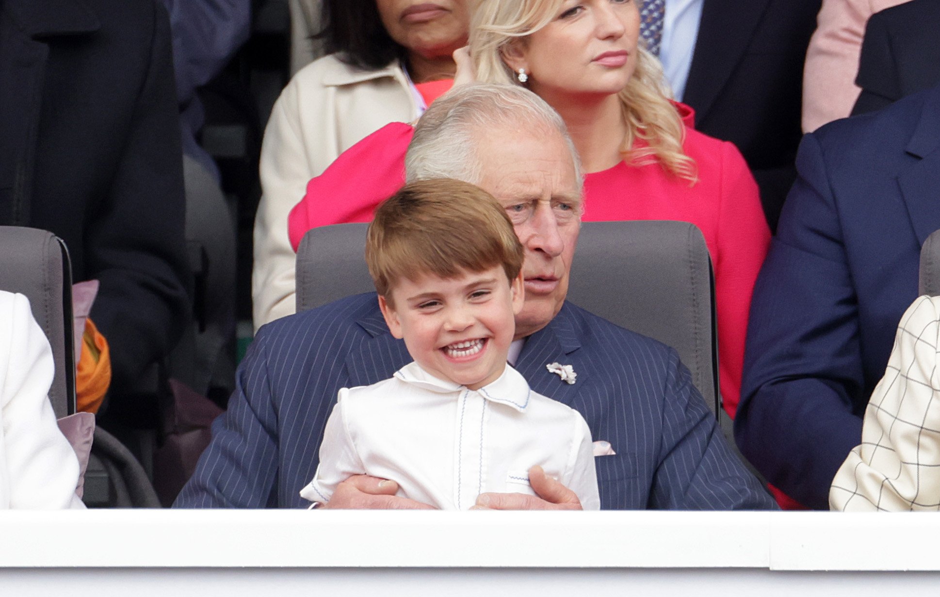 Prince Louis of Cambridge sits on Prince Charles, Prince of Wales lap at the Platinum Pageant on June 05, 2022 in London, England. | Source: Getty Images