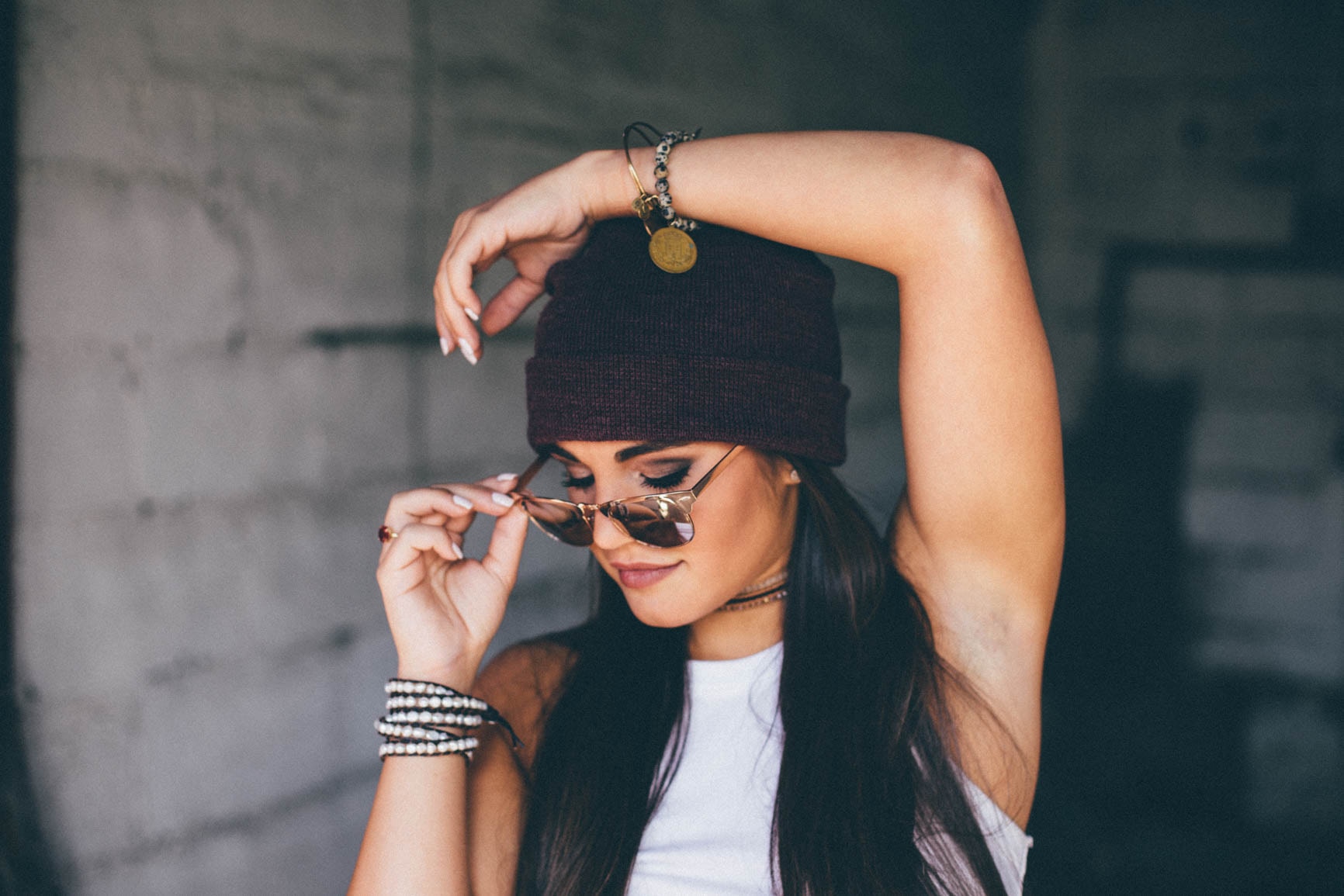 Woman posing with her sunglasses. | Source: Unsplash