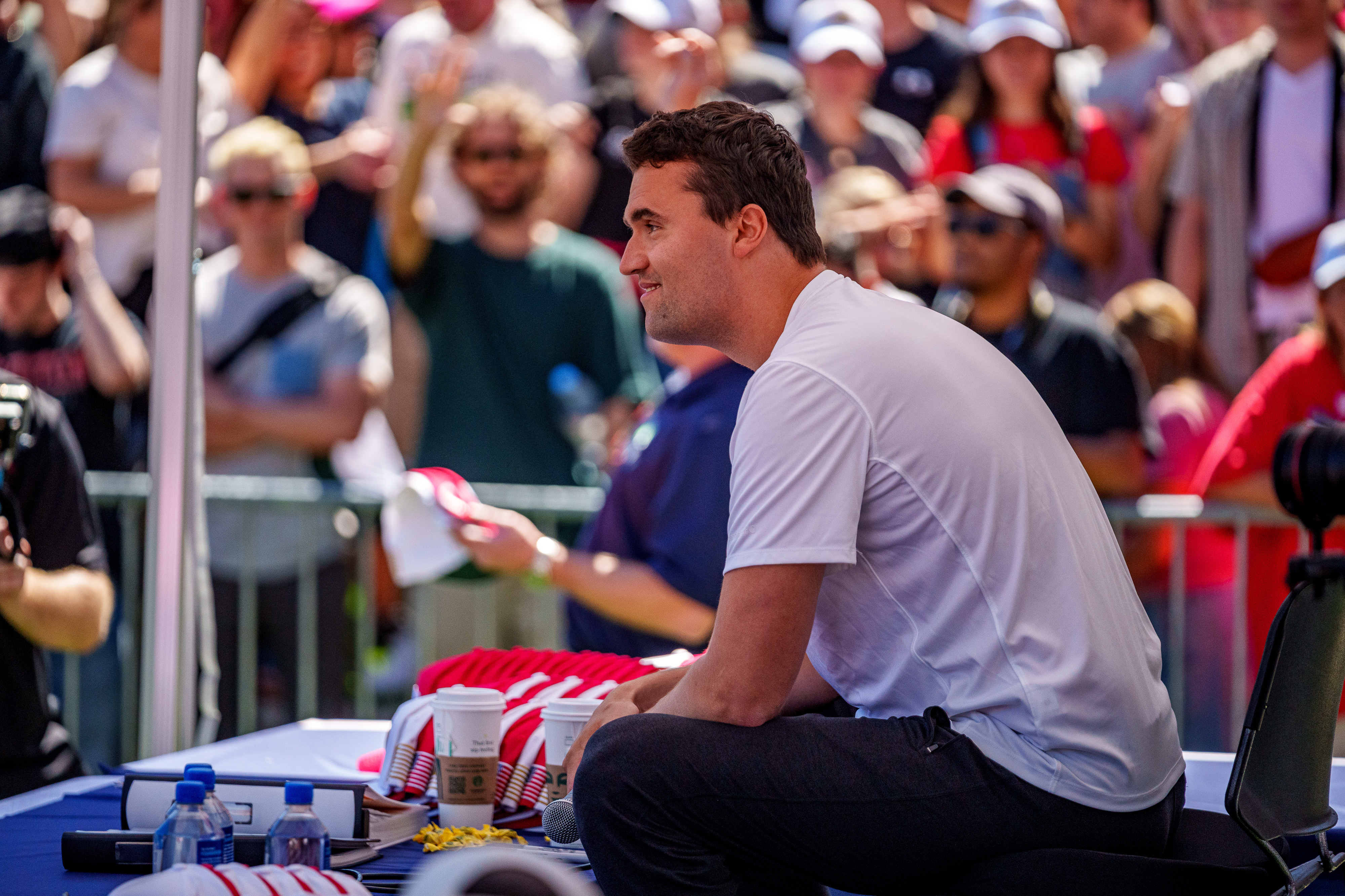 Charlie Kirk smiling at the crowd during the Utah event. | Source: Getty Images