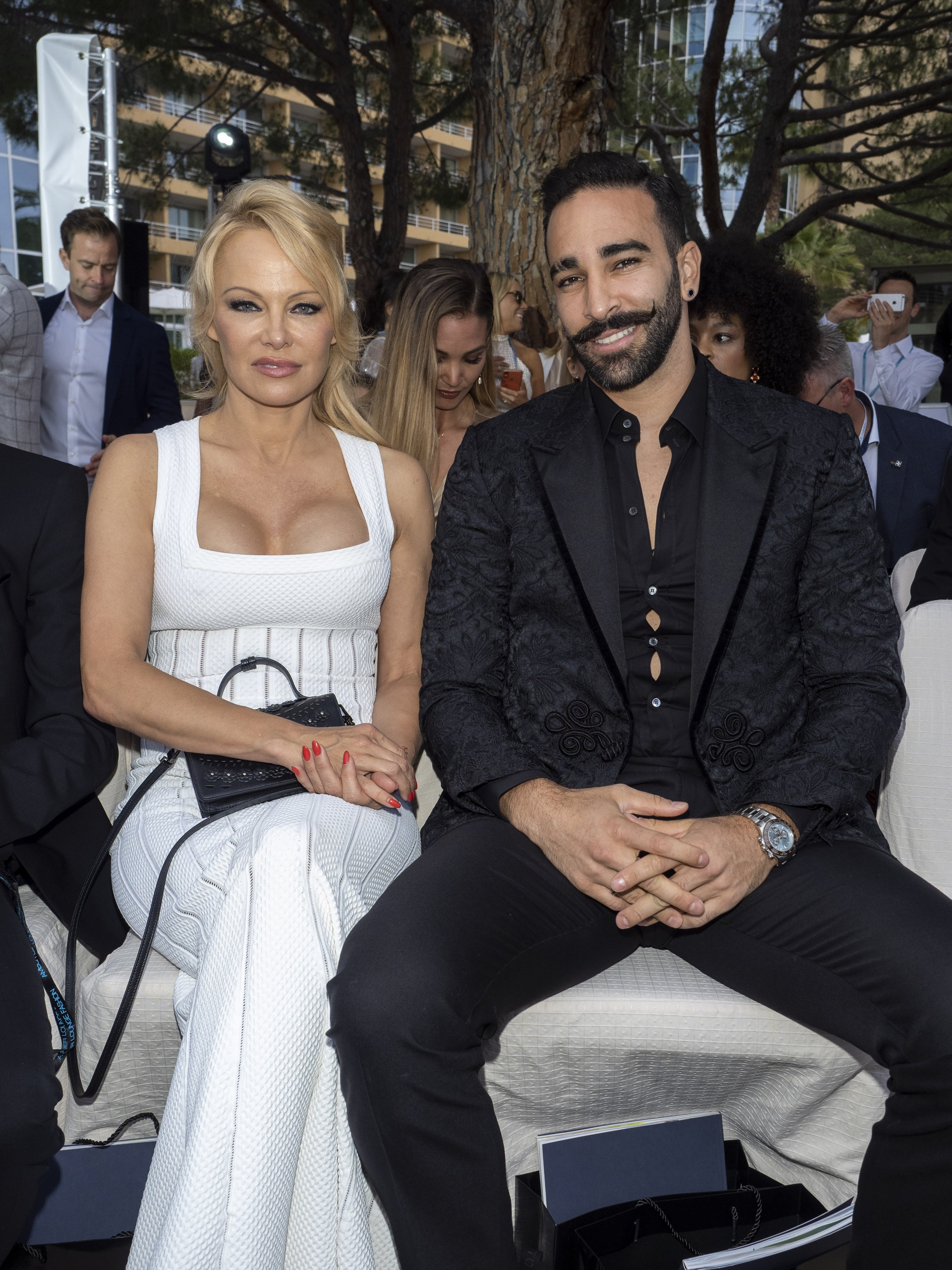 Pamela Anderson and Adil Rami attend Amber Lounge 2019 Fashion Show. | Source: Getty Image