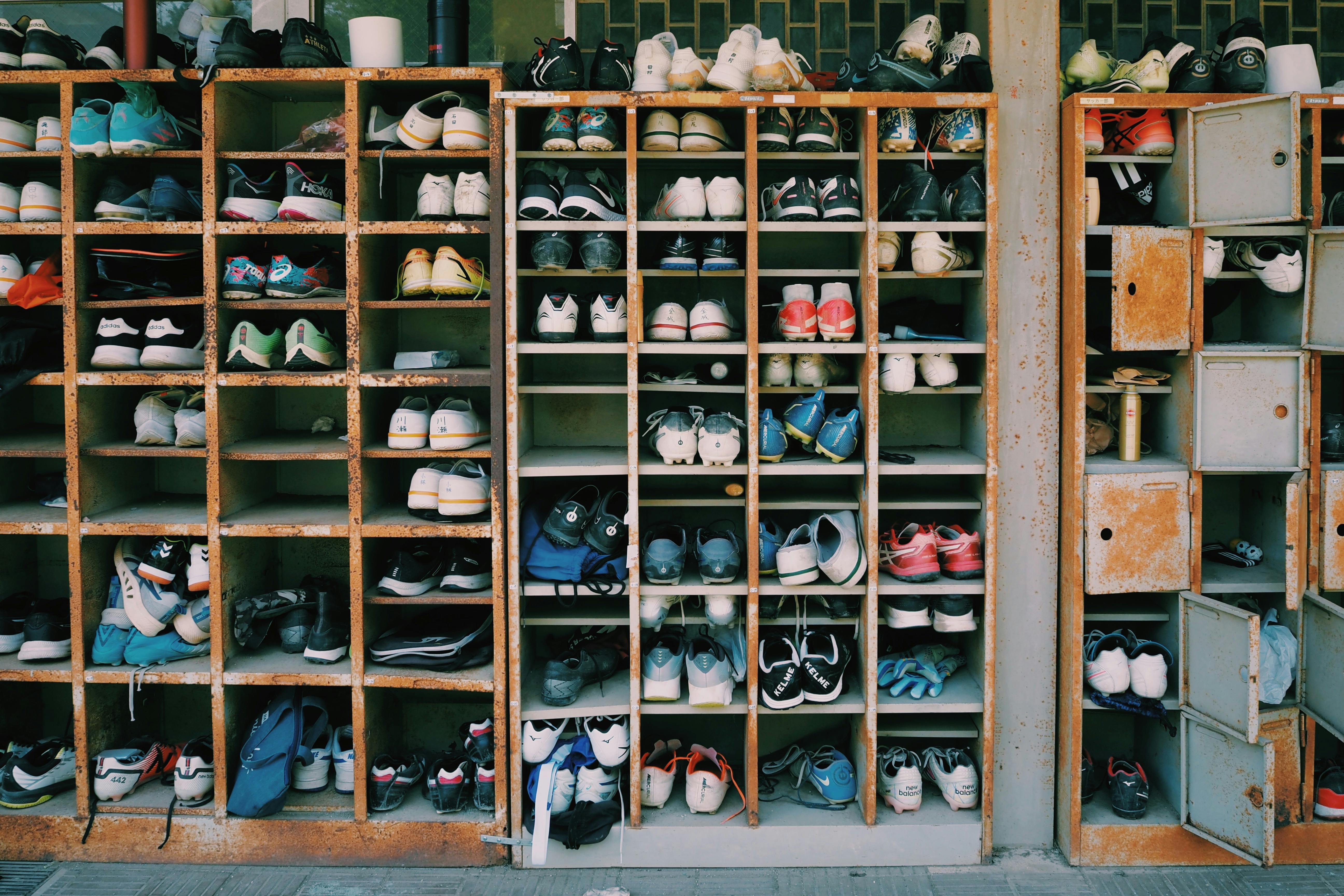 Shoe compartments with shoes stored inside | Source: Pexels