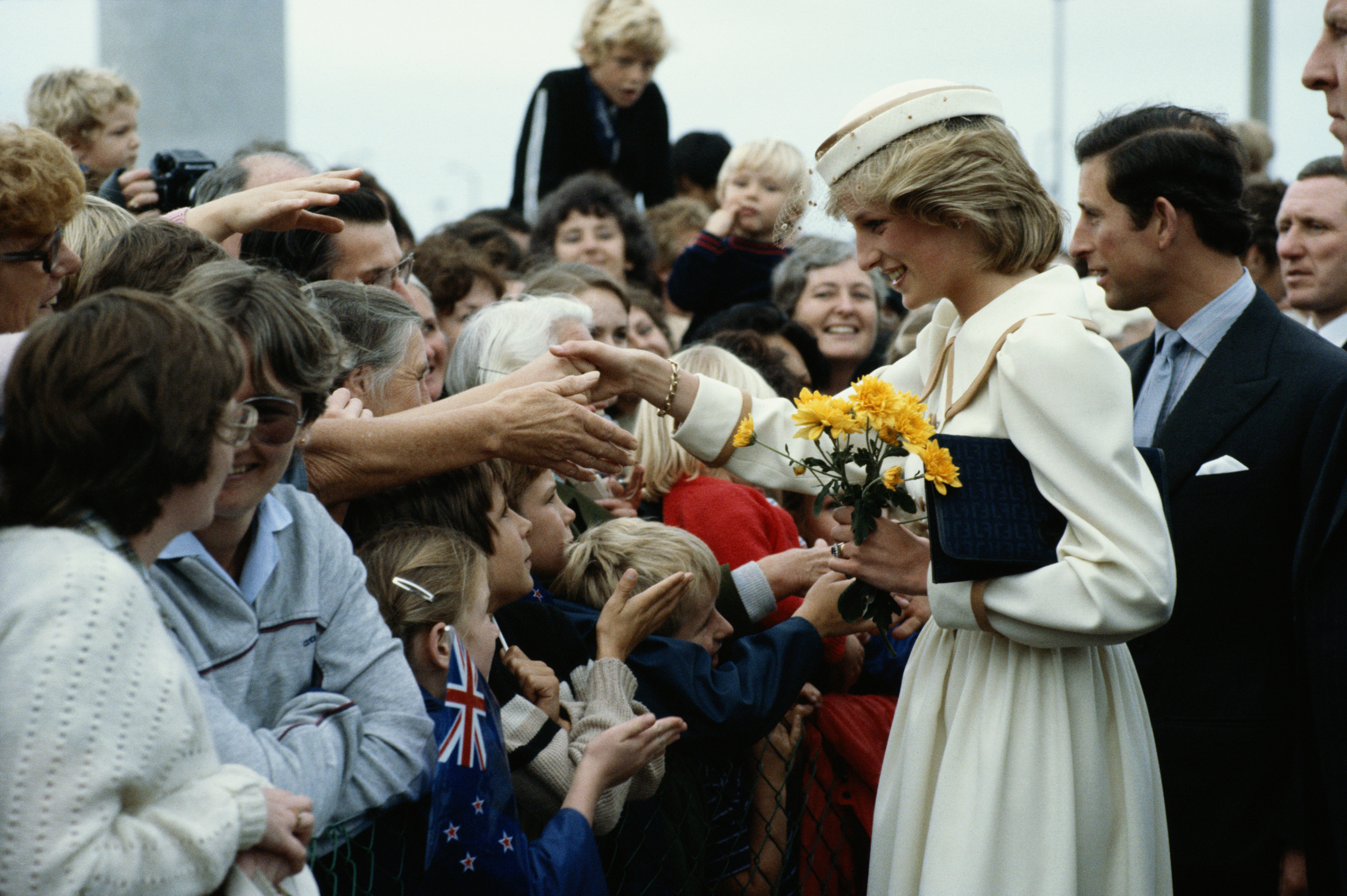 Late Princess Diana and King Charles III meeting the crowd on April 17, 1983, during their arrival in Auckland, New Zealand | Source: Getty Images