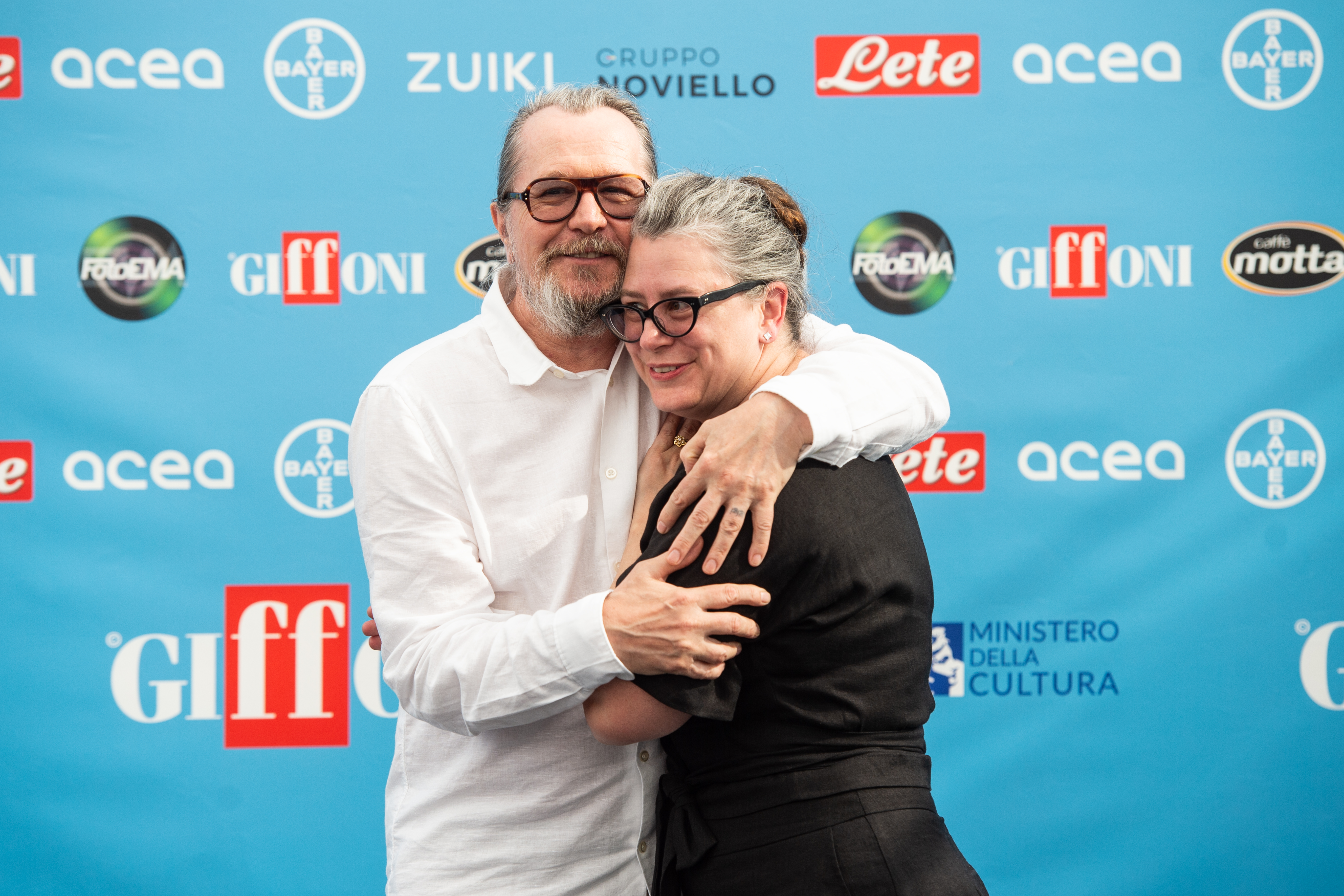 Actor Gary Oldman and his wife Gisele Schmidt attend the photocall at the Giffoni Film Festival 2022 on July 28, 2022 in Giffoni Valle Piana, Italy | Source: Getty Images