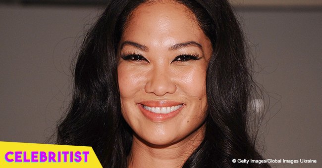 Kimora Lee Simmons' daughter showcases curves in black swimsuit in photo with long pink hair