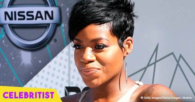 Fantasia stuns in pink top and skintight jeans in photo with friends on her birthday