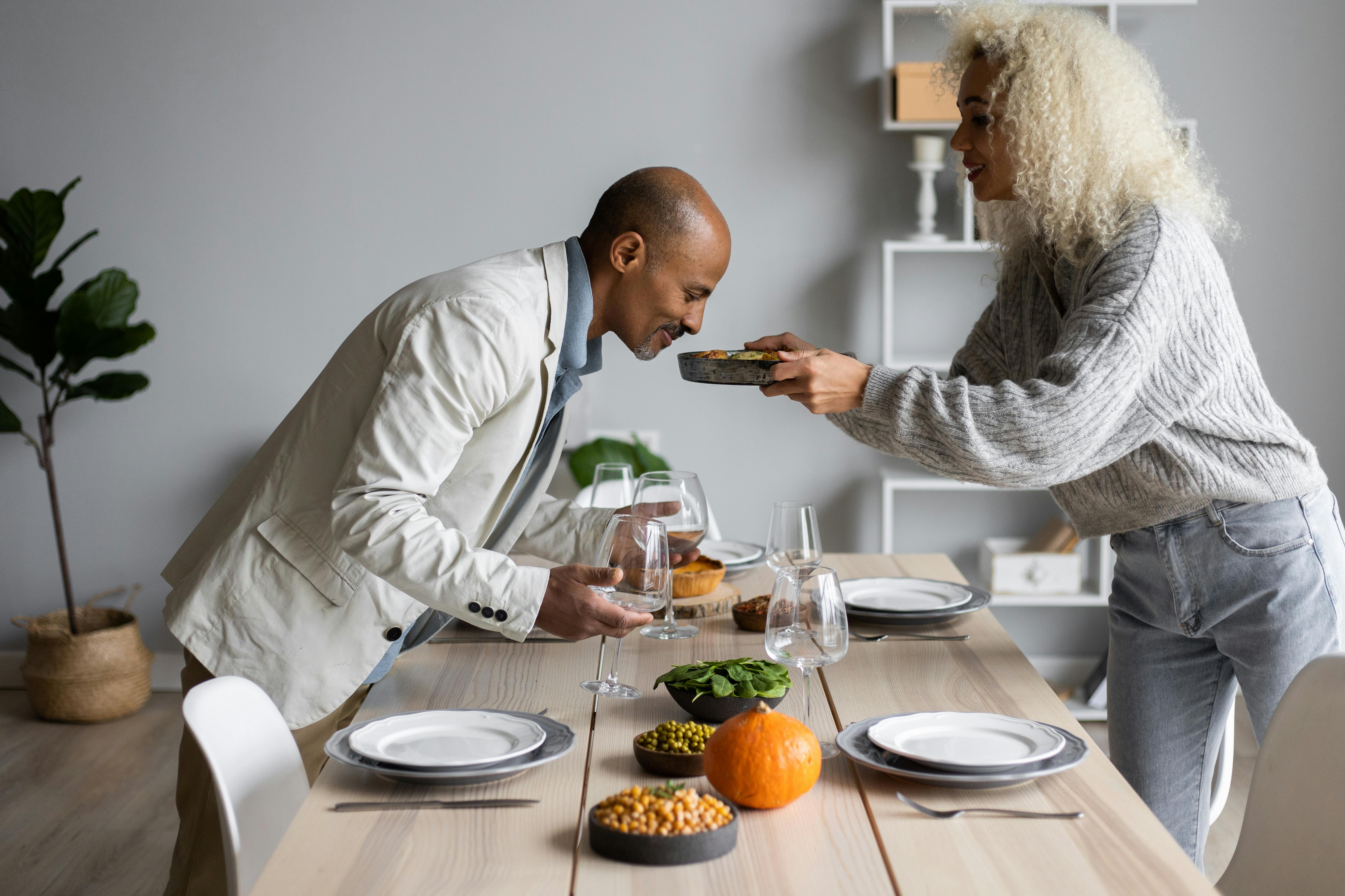 Woman serving her husband food | Source: Pexels