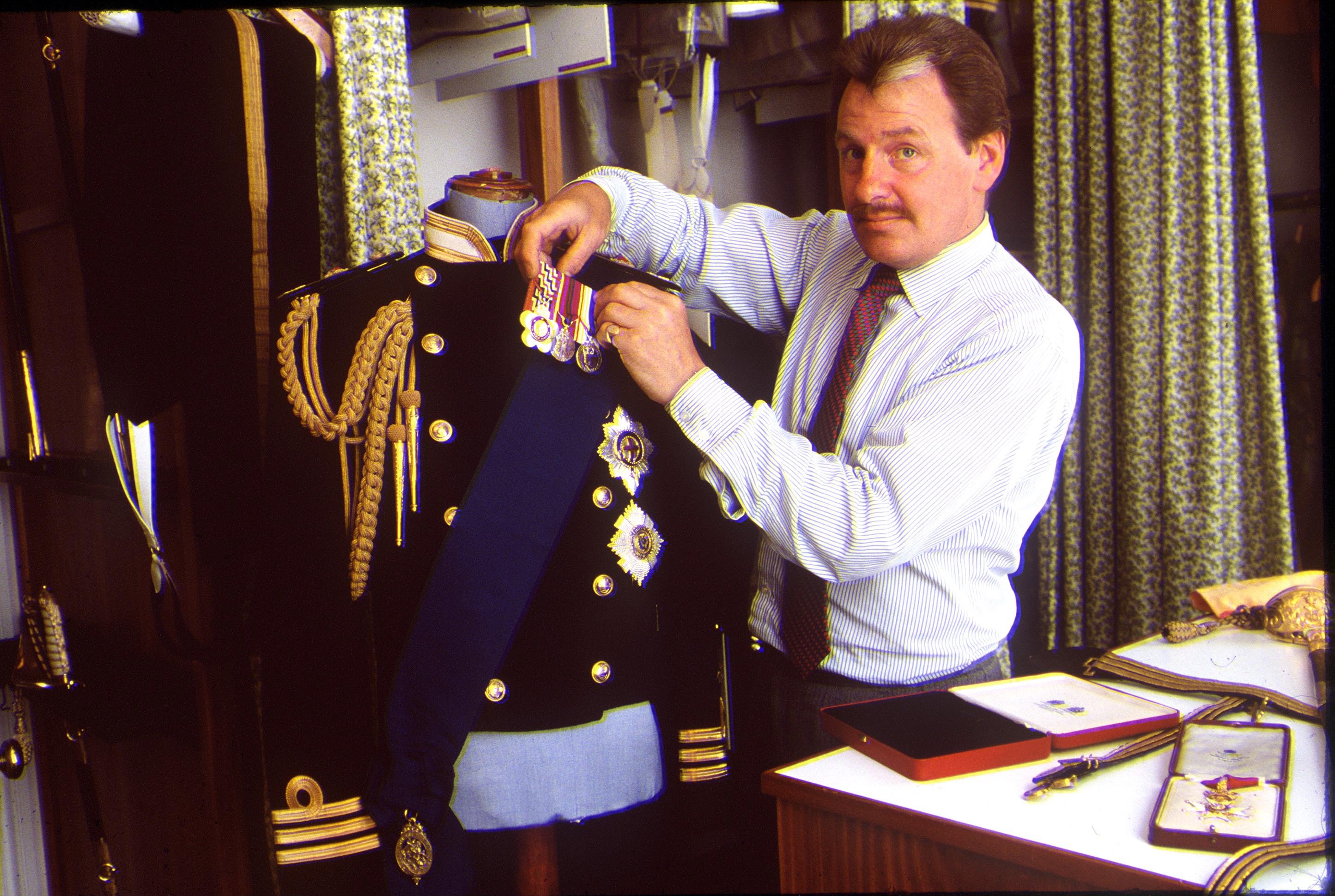 Prince Charles' valet, Ken Stronach, in the Uniform Room at Kensington Palace on July 17, 1986, in London, United Kingdom | Source: Getty Images