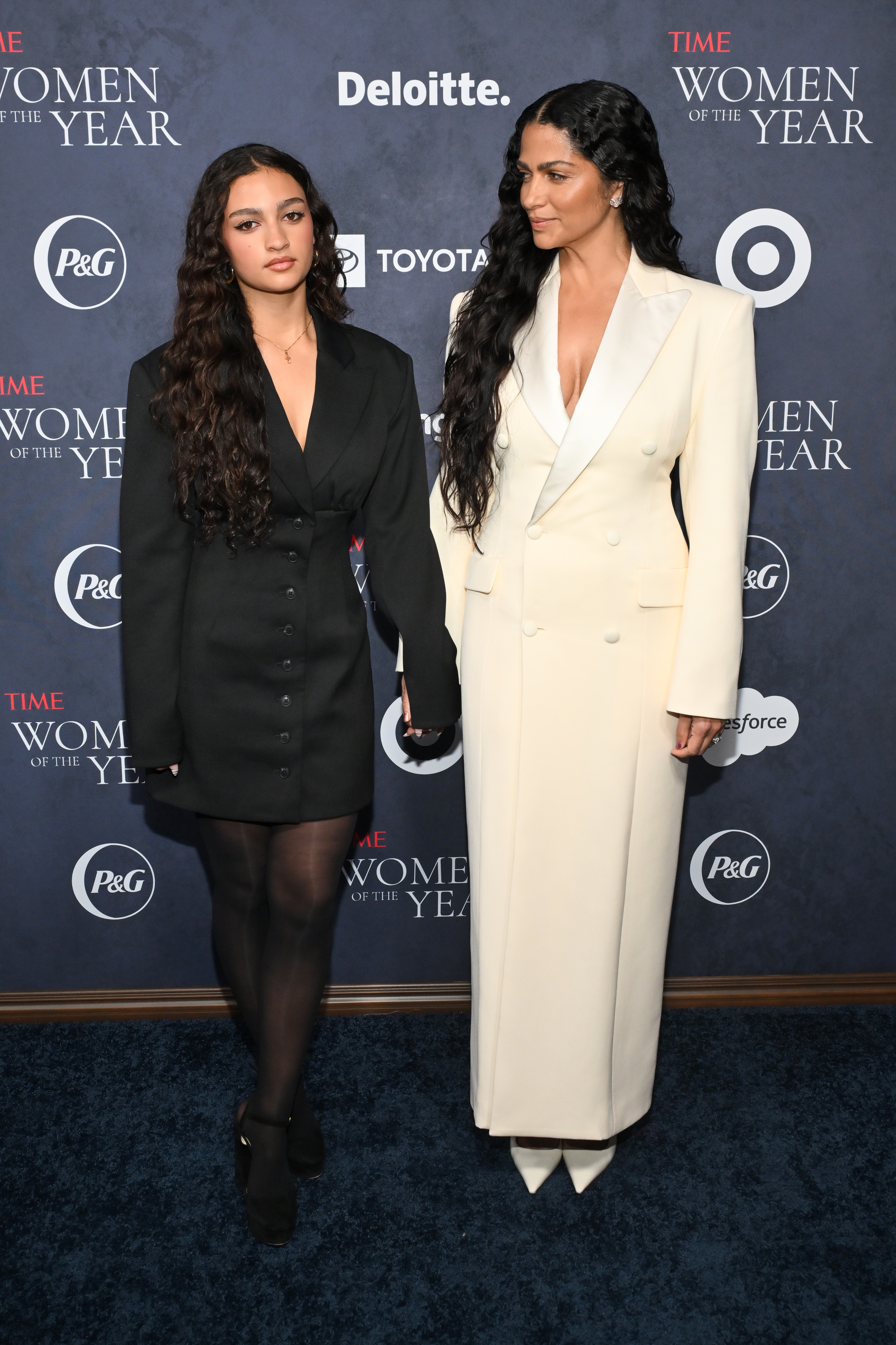 Vida McConaughey and Camila Alves holding hands at the event as Camila looks lovingly at her daughter. | Source: Getty Images