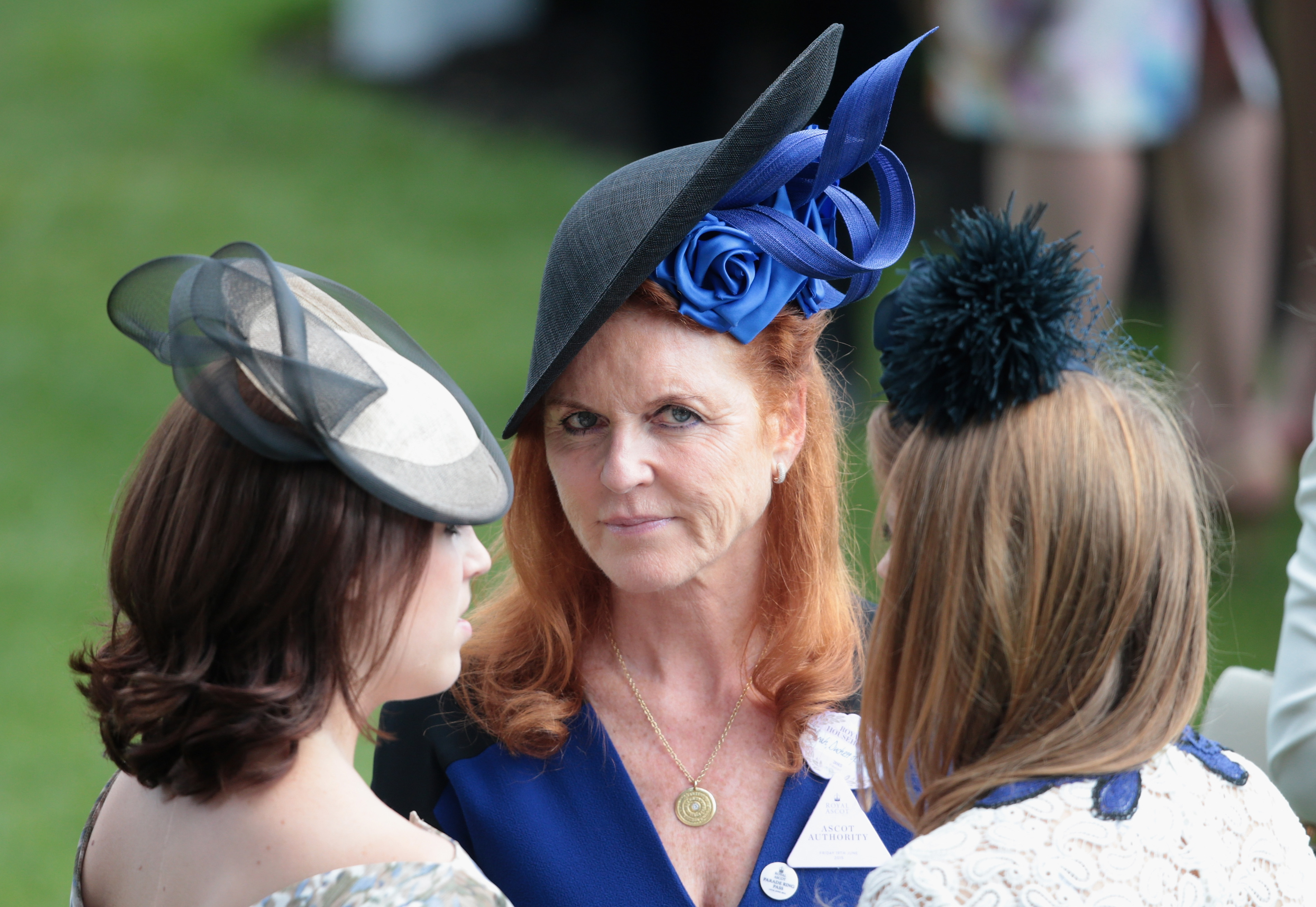Princess Eugenie, Sarah Ferguson, and Princess Beatrice hold hands in the parade ring on day 4 of Royal Ascot at Ascot Racecourse on 19 June 2015 in Ascot, England. | Source: Getty Images