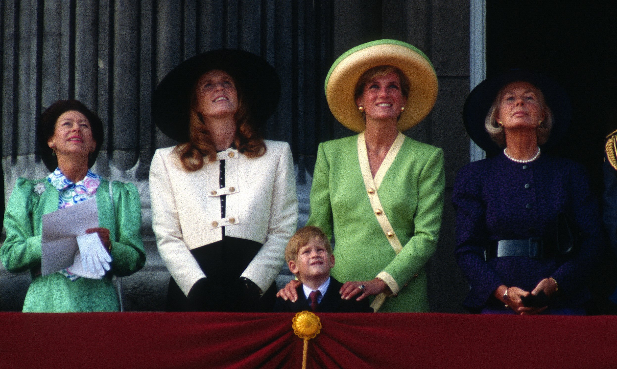  Princess Margaret, Sarah, Duchess of York, Prince Harry, Diana, Princess of Wales and the Duchess of Kent stand on the balcony of Buckingham Palace to watch The Battle of Britain Anniversary Parade on September 15, 1990 | Photo: GettyImages