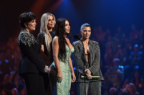 Kris Jenner, Kim Kardashian, Khloé Kardashian, and Kourtney Kardashian accept The Reality Show of 2019 for 'Keeping Up with the Kardashians' on stage during the 2019 E! People's Choice Awards held at the Barker Hangar on November 10, 2019 | Photo: Getty Images