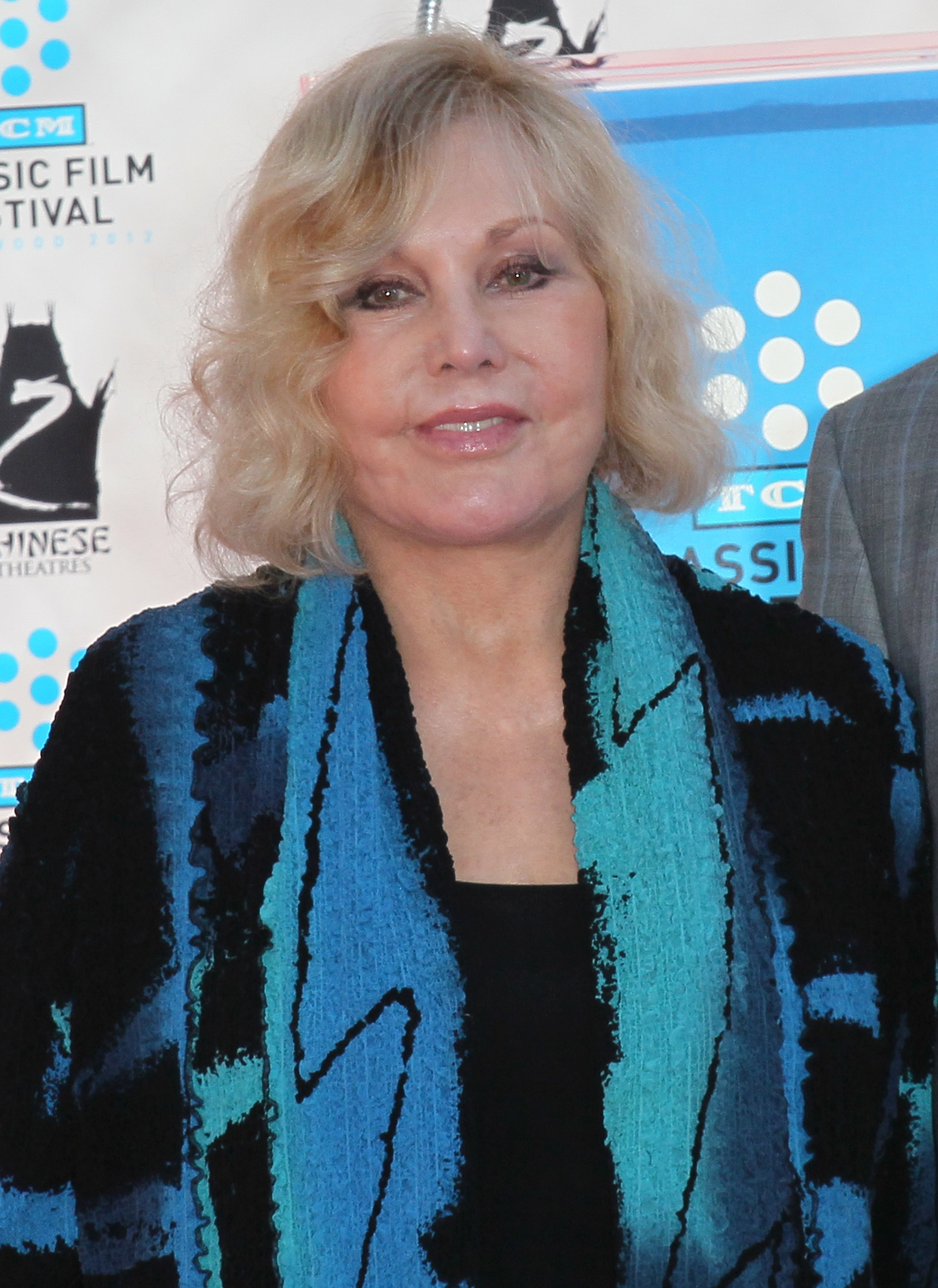 Kim Novak is immortalized with a hand and footprint ceremony as part of the 2012 TCM Classic Film Festival at Grauman's Chinese Theatre in Hollywood, California, on April 14, 2012. | Source: Getty Images