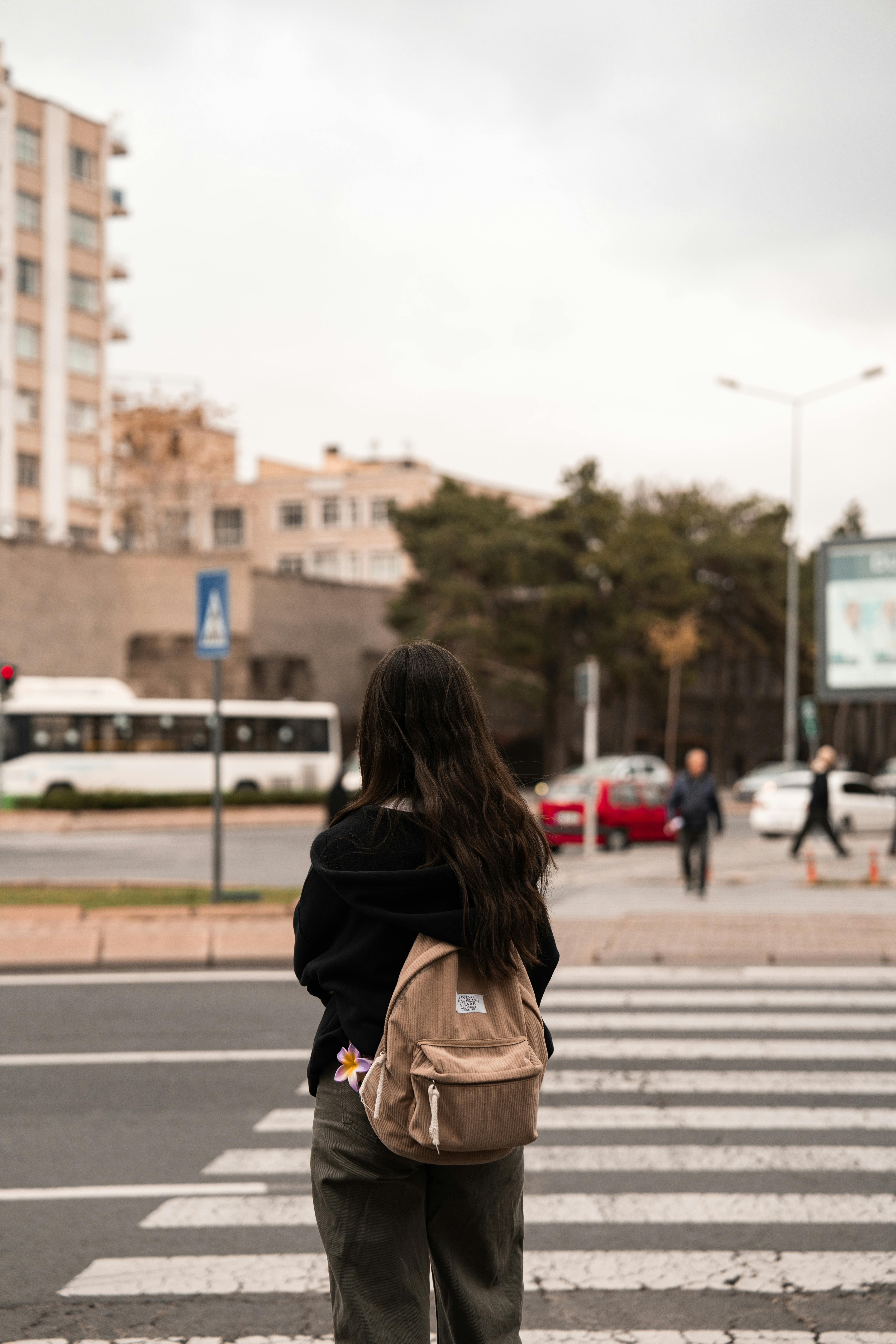 A woman standing in the street | Source: Pexels