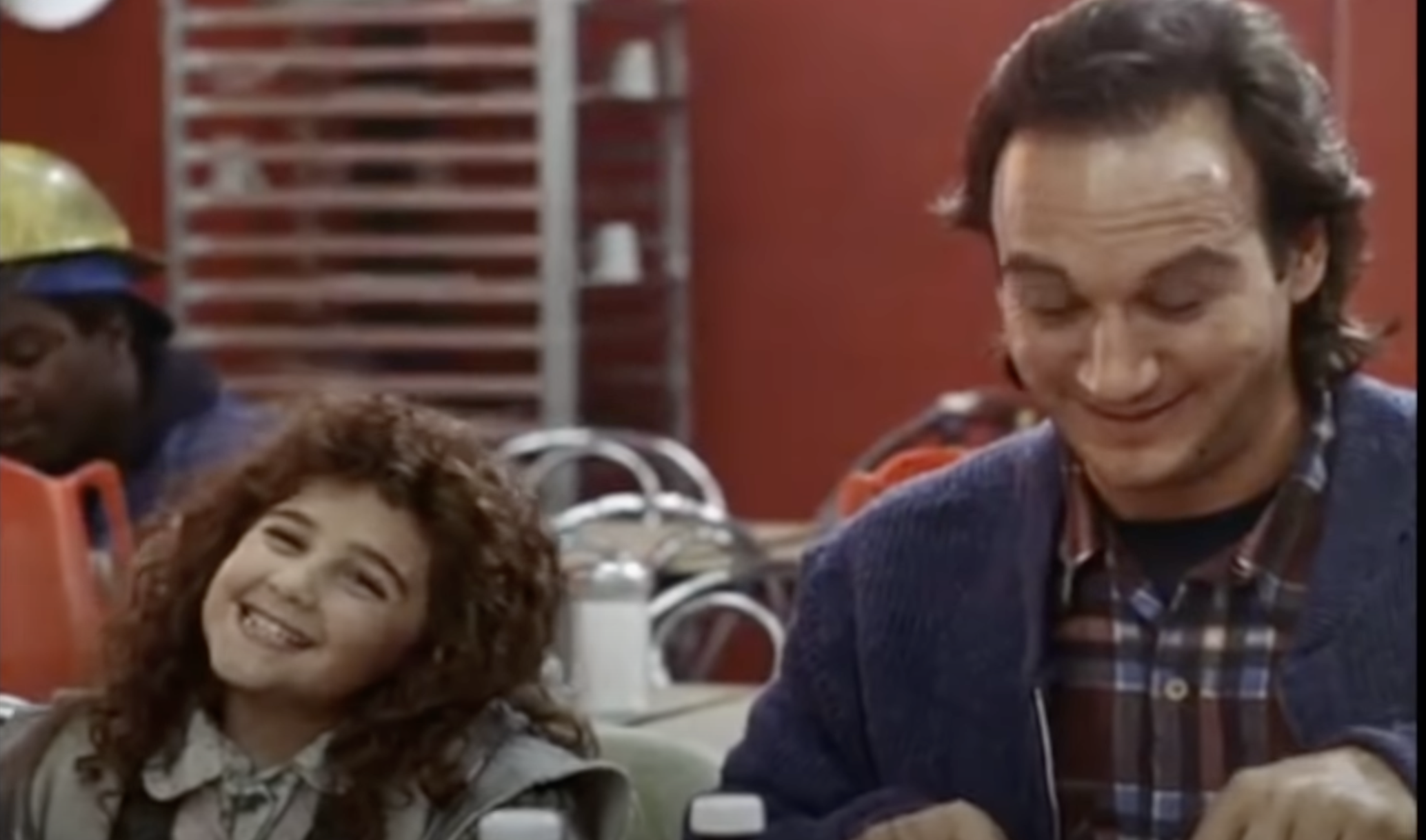 The child star as Curly Sue in "Curly Sue" in 1991. | Source: YouTube/ Rotten Tomatoes Classic Trailers