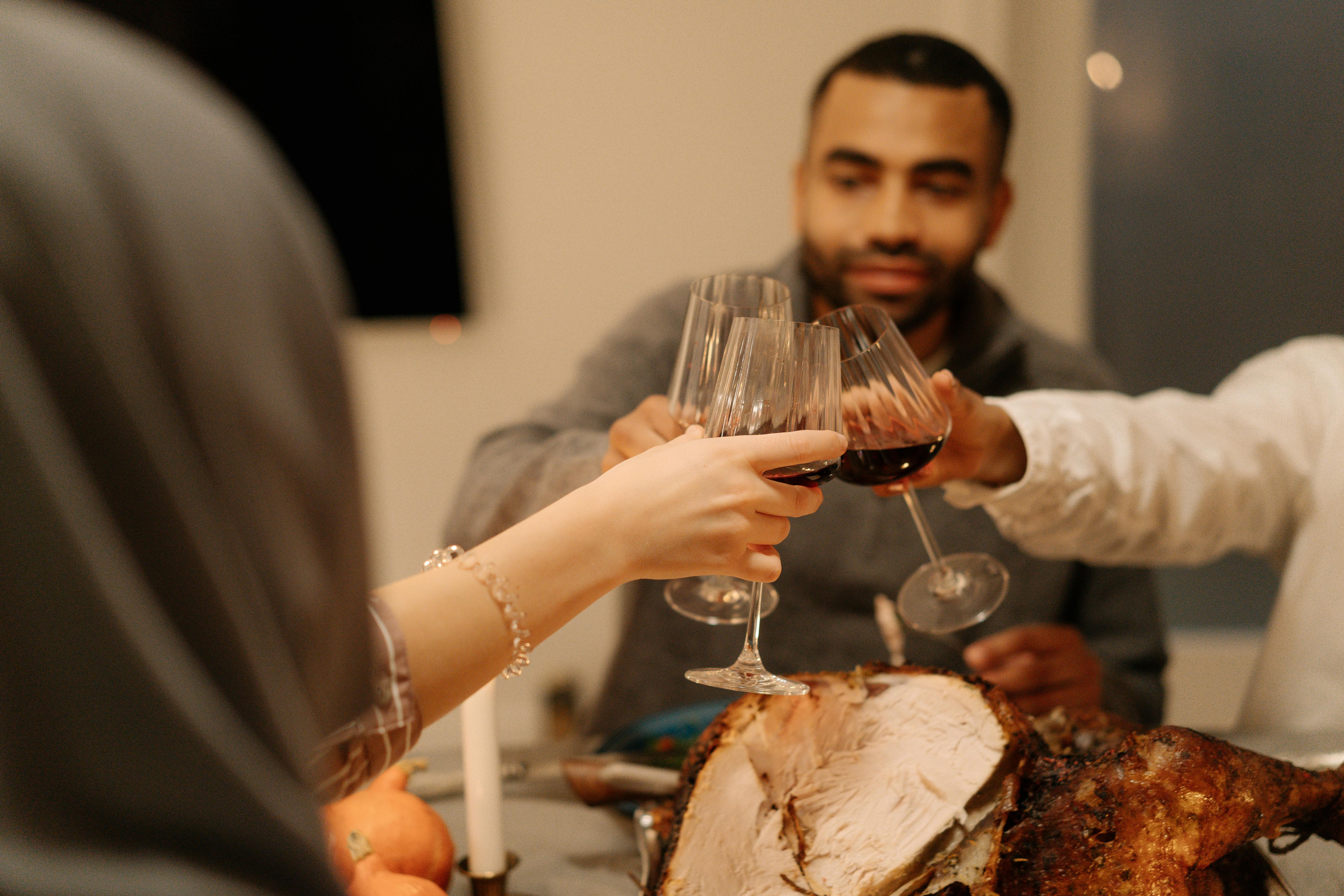 Man toasts at a party | Source: Pexels