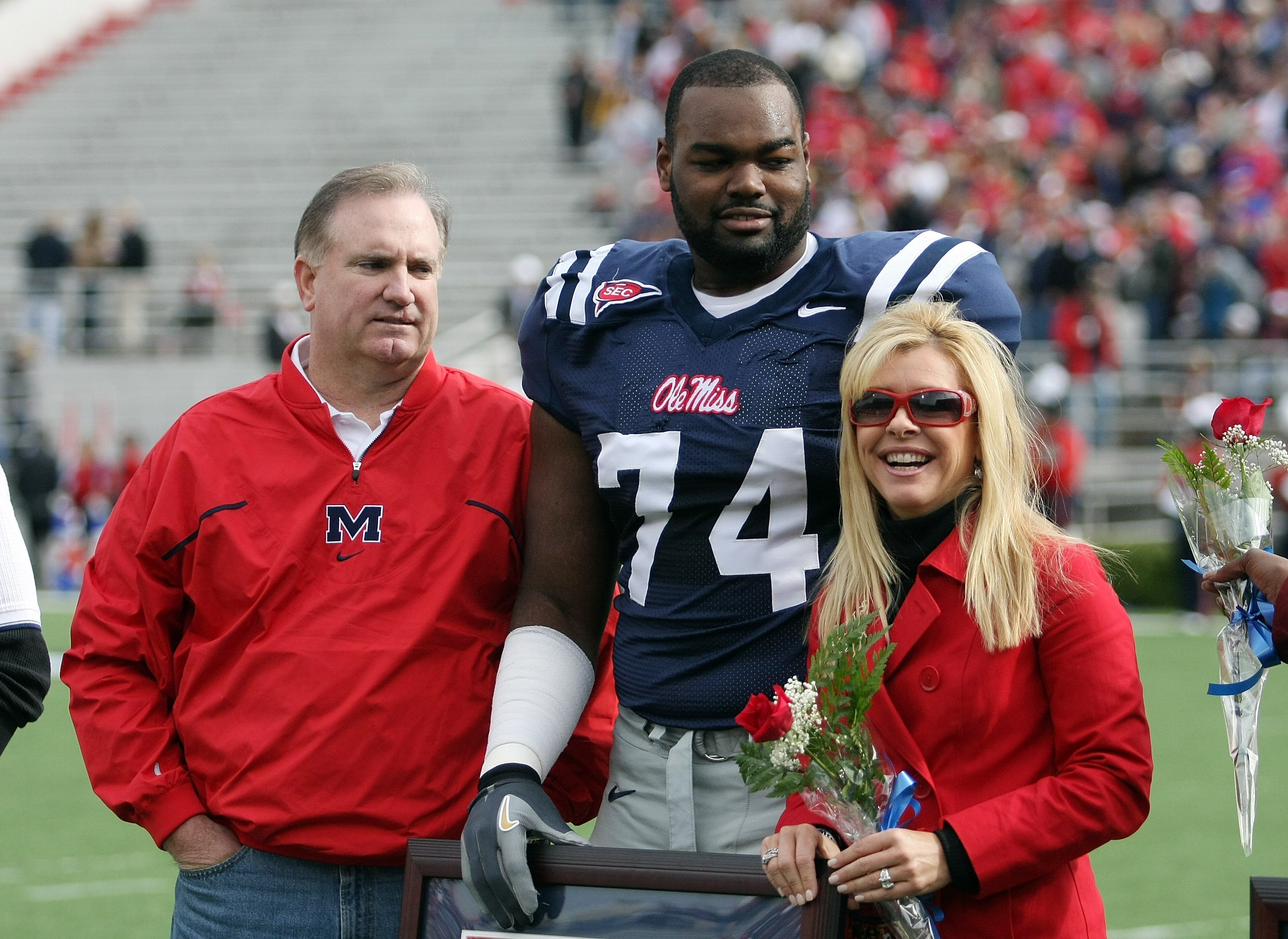 Michael Oher #74 of the Ole Miss Rebels stands with his family during senior ceremonies prior to a game against the Mississippi State Bulldogs at Vaught-Hemingway Stadium on November 28, 2008 in Oxford, Mississippi | Source: Getty Images 