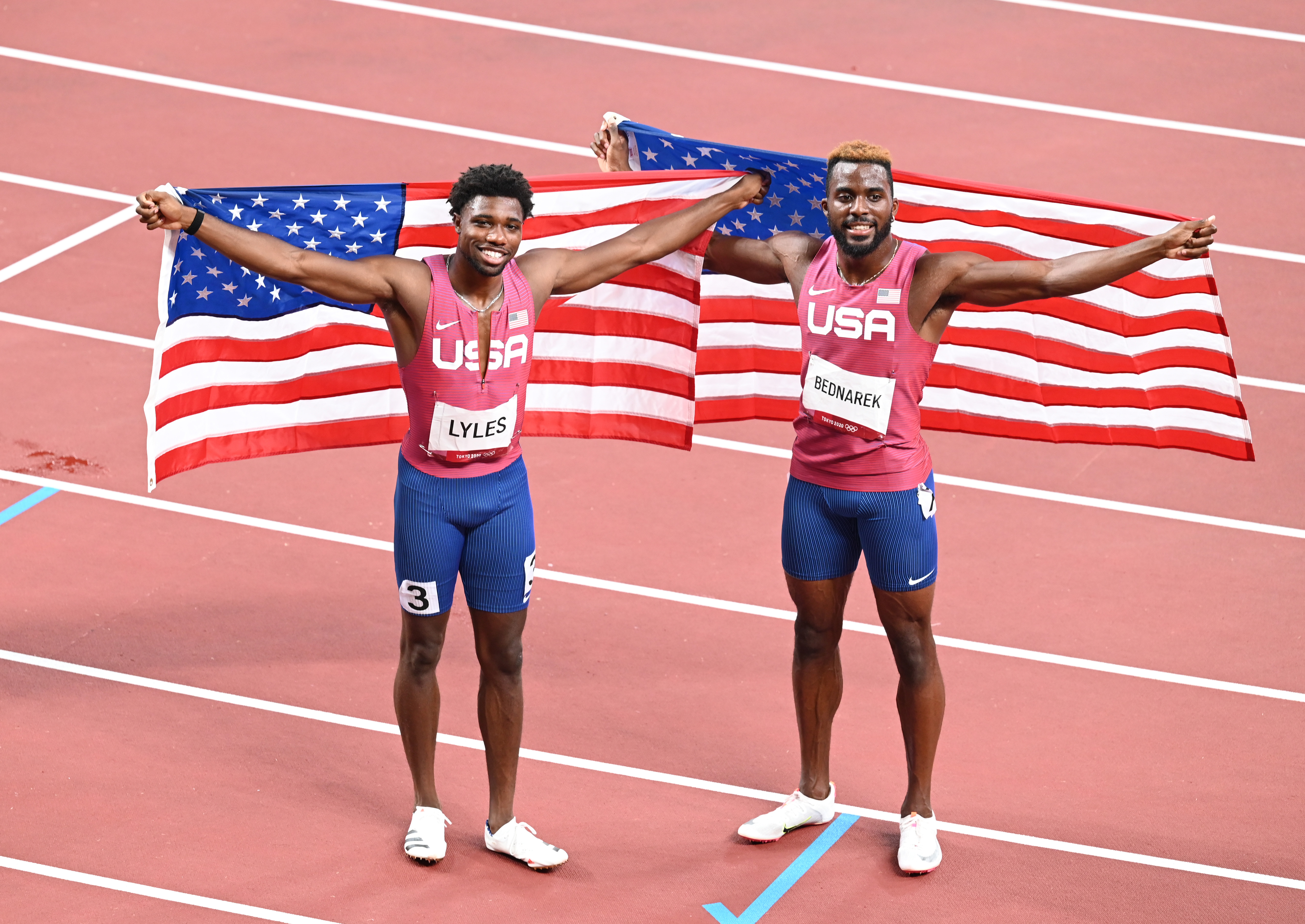 Noah Lyles of The USA and silver medalist Kenneth Bednarek of The USA celebrate after the Men's 200m Final during the Tokyo 2020 Olympic Games at Olympic Stadium in Tokyo, Japan on August 04, 2021 | Source: Getty Images