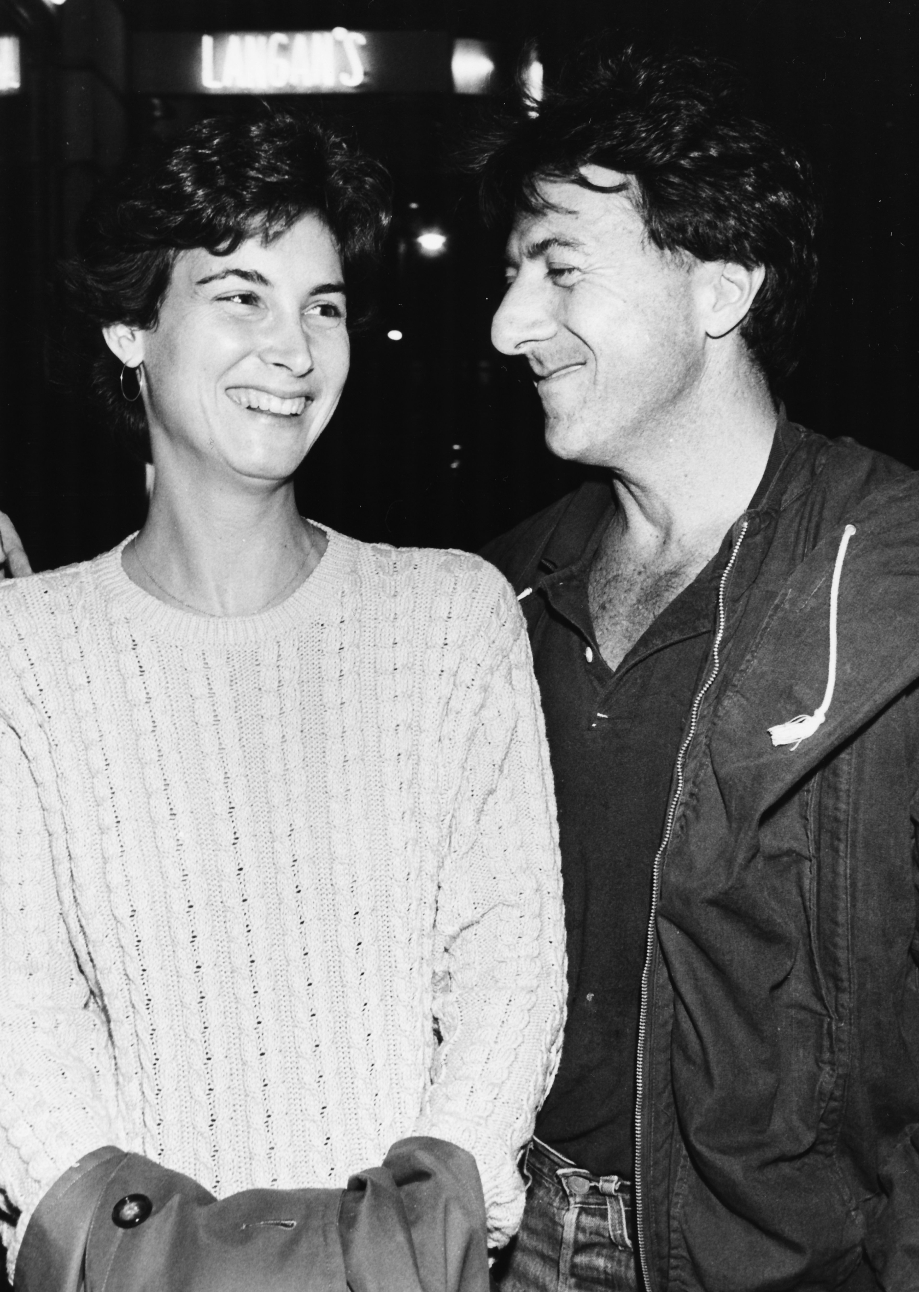 Actor Dustin Hoffman and his wife Lisa laughing together as they leave Langan's Brasserie in London, October 20th 1983. | Source: Getty Images
