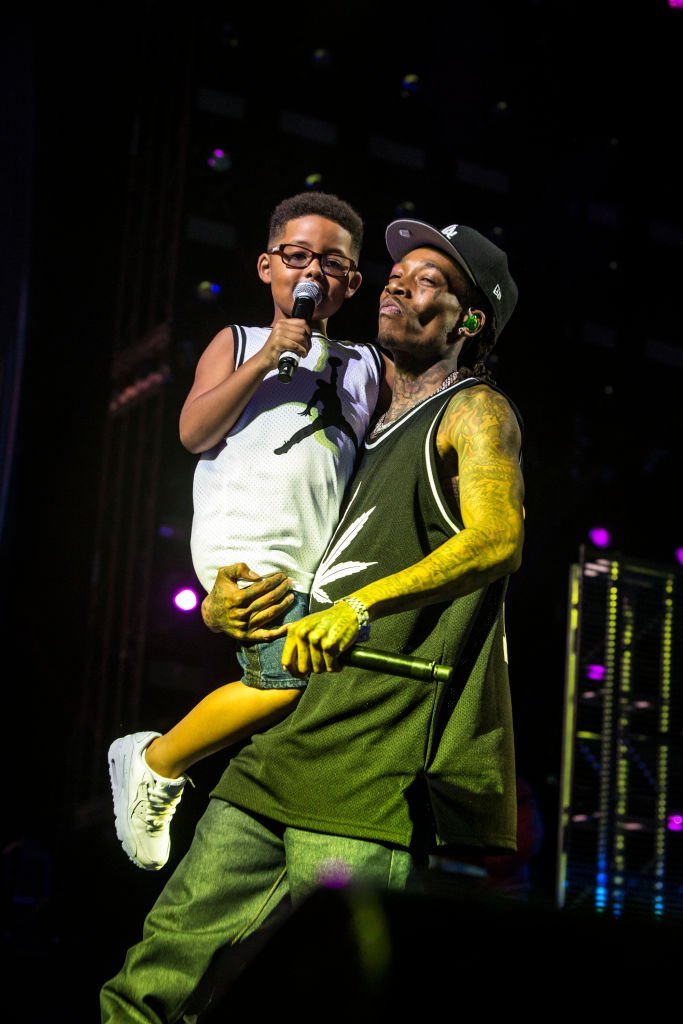Rapper Wiz Khalifa performing with his son, Sebastian Taylor Thomas in August 2019. | Photo: Getty Images