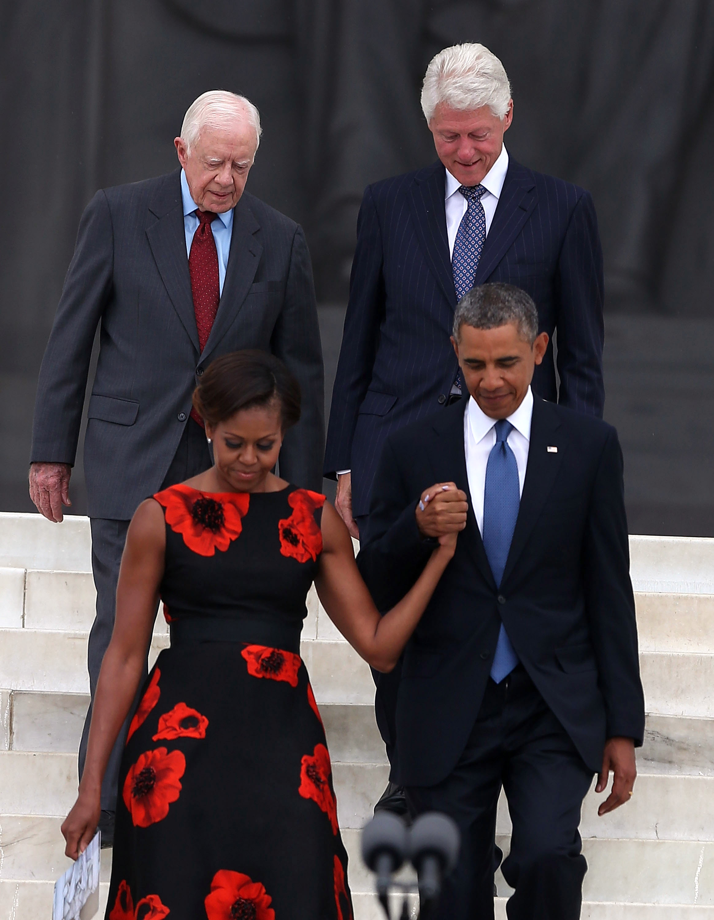 Jimmy Carter and Bill Clinton photographed with Michelle and Barack Obama on August 28, 2013, in Washington, D.C. | Source: Getty Images