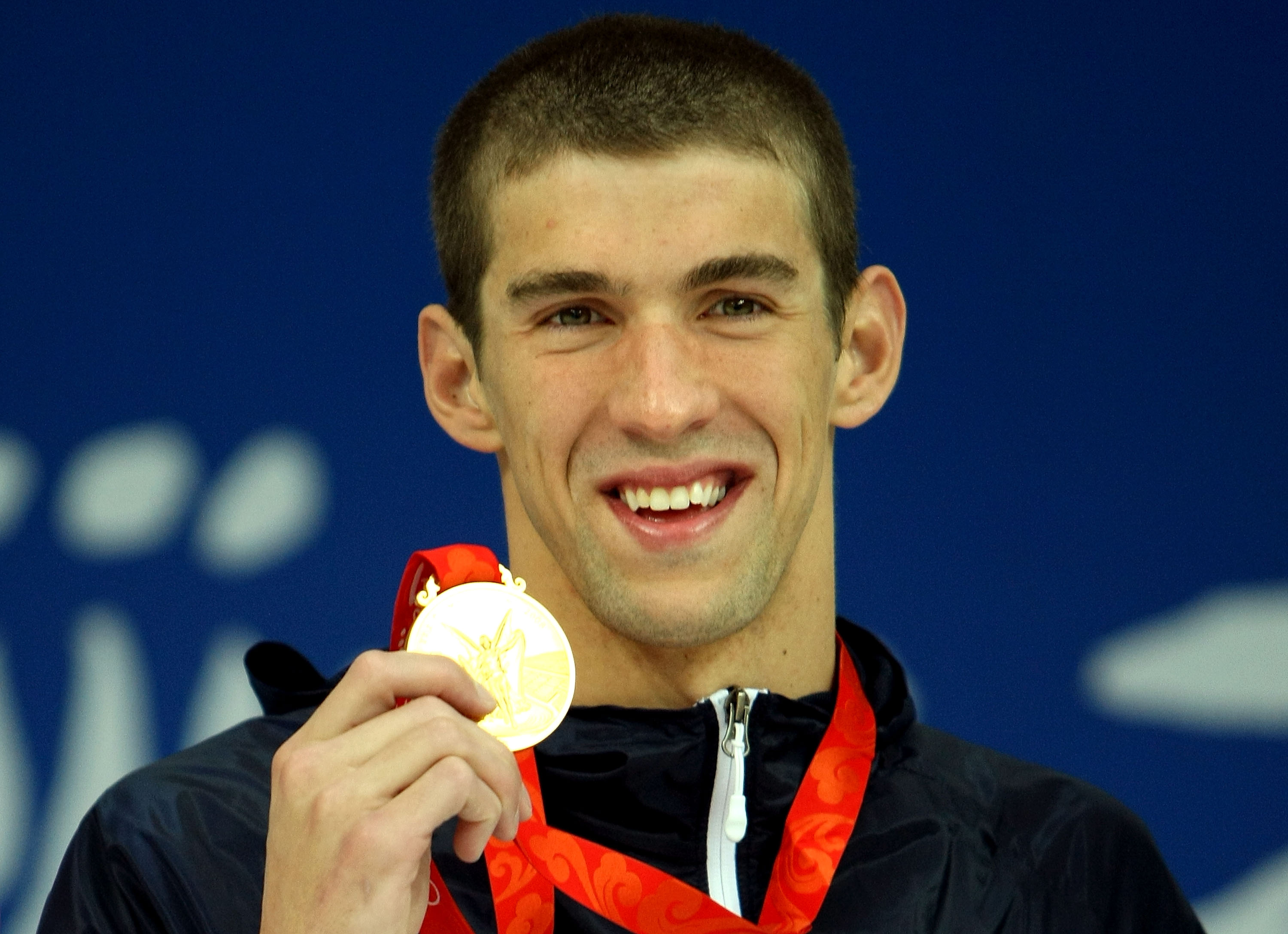 Michael Phelps receives the gold medal during the Beijing 2008 Olympic Games on August 10, 2008 in Beijing, China. | Source: Getty Images