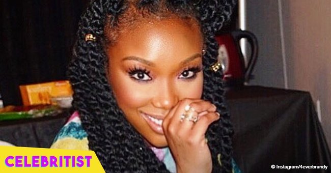 Brandy flaunts fuller curves in yellow off-shoulder dress after recent weight gain