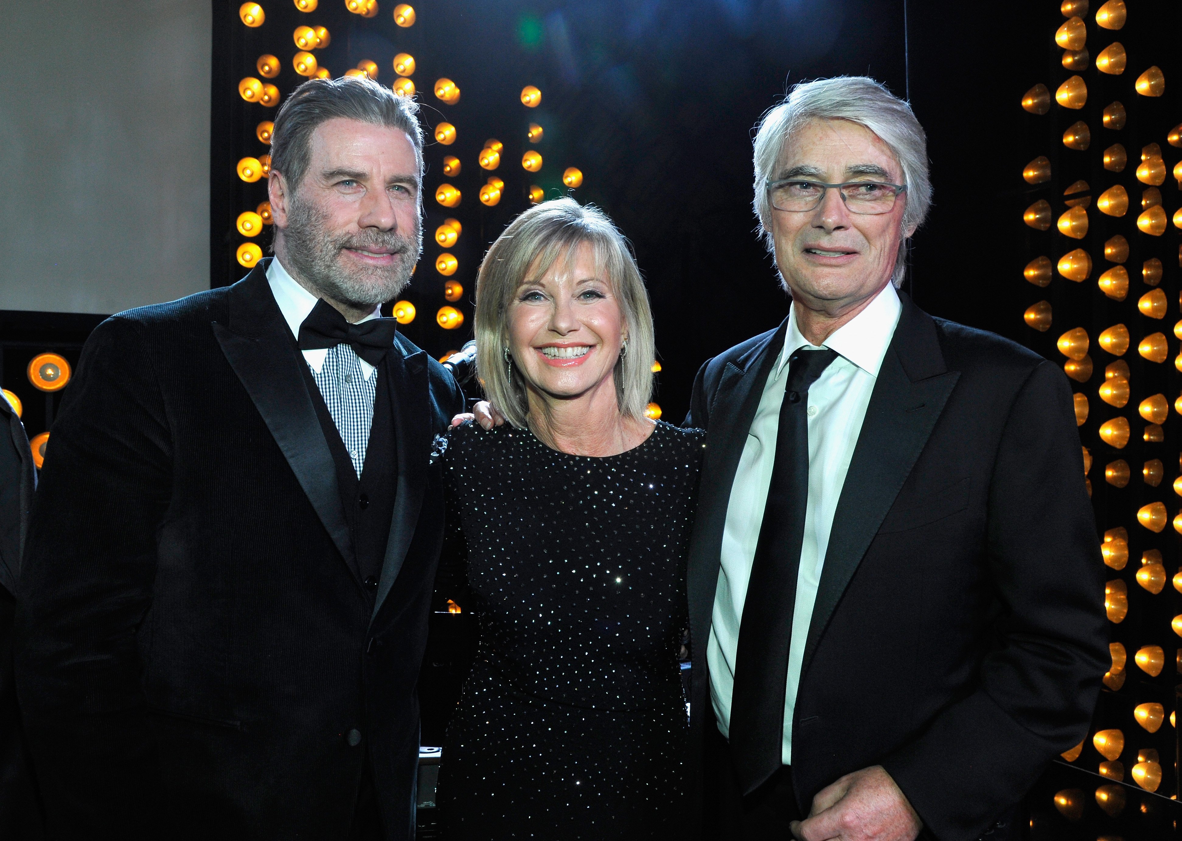 John Travolta, Olivia Newton John, and Honoree John Farrar attend the 2018 G'Day USA Black Tie Gala on January 27, 2018, in Los Angeles, California. | Source: Getty Images.