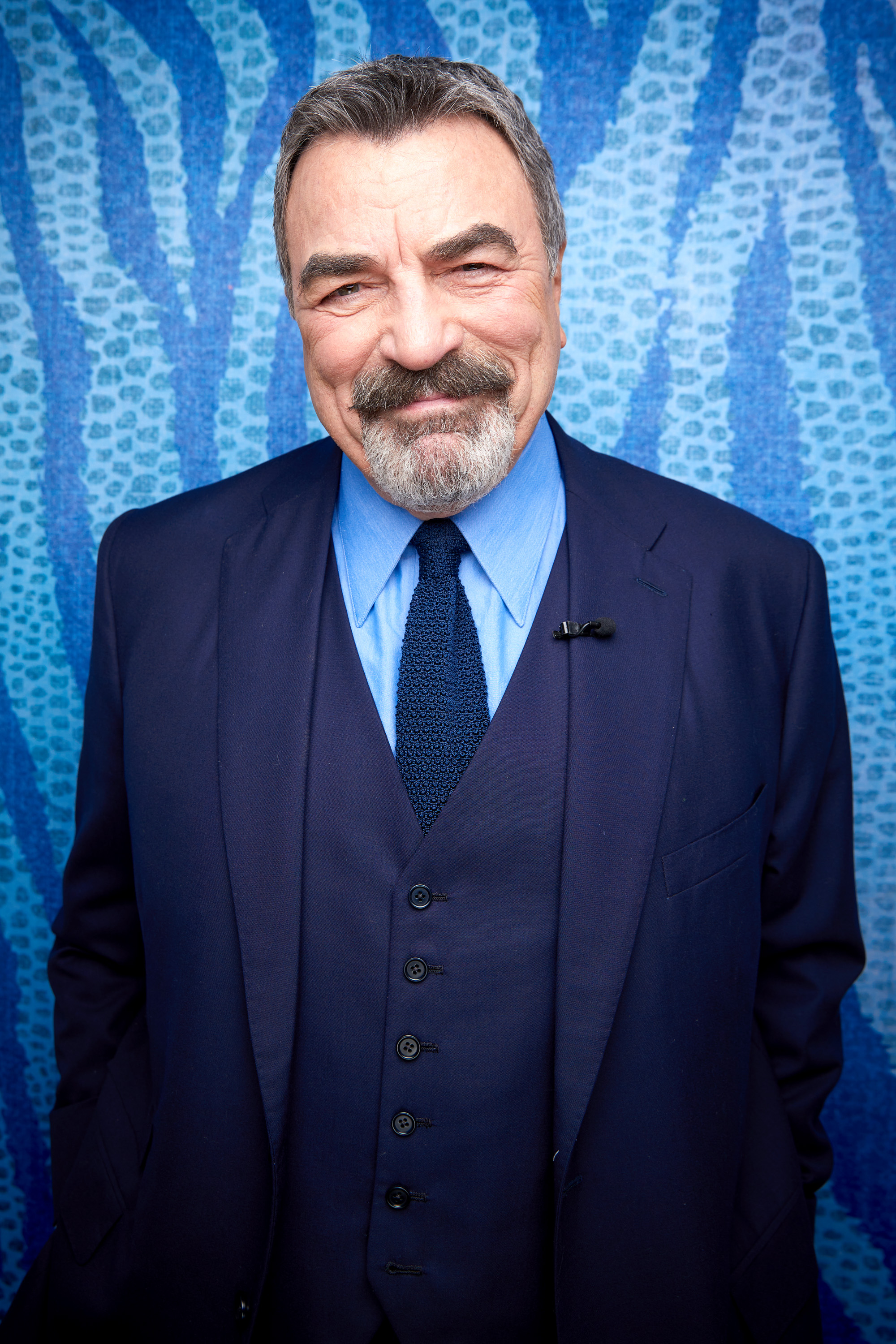 Tom Selleck posing for a picture at "The Kelly Clarkson Show" on April 14, 2022. | Source: Getty Images