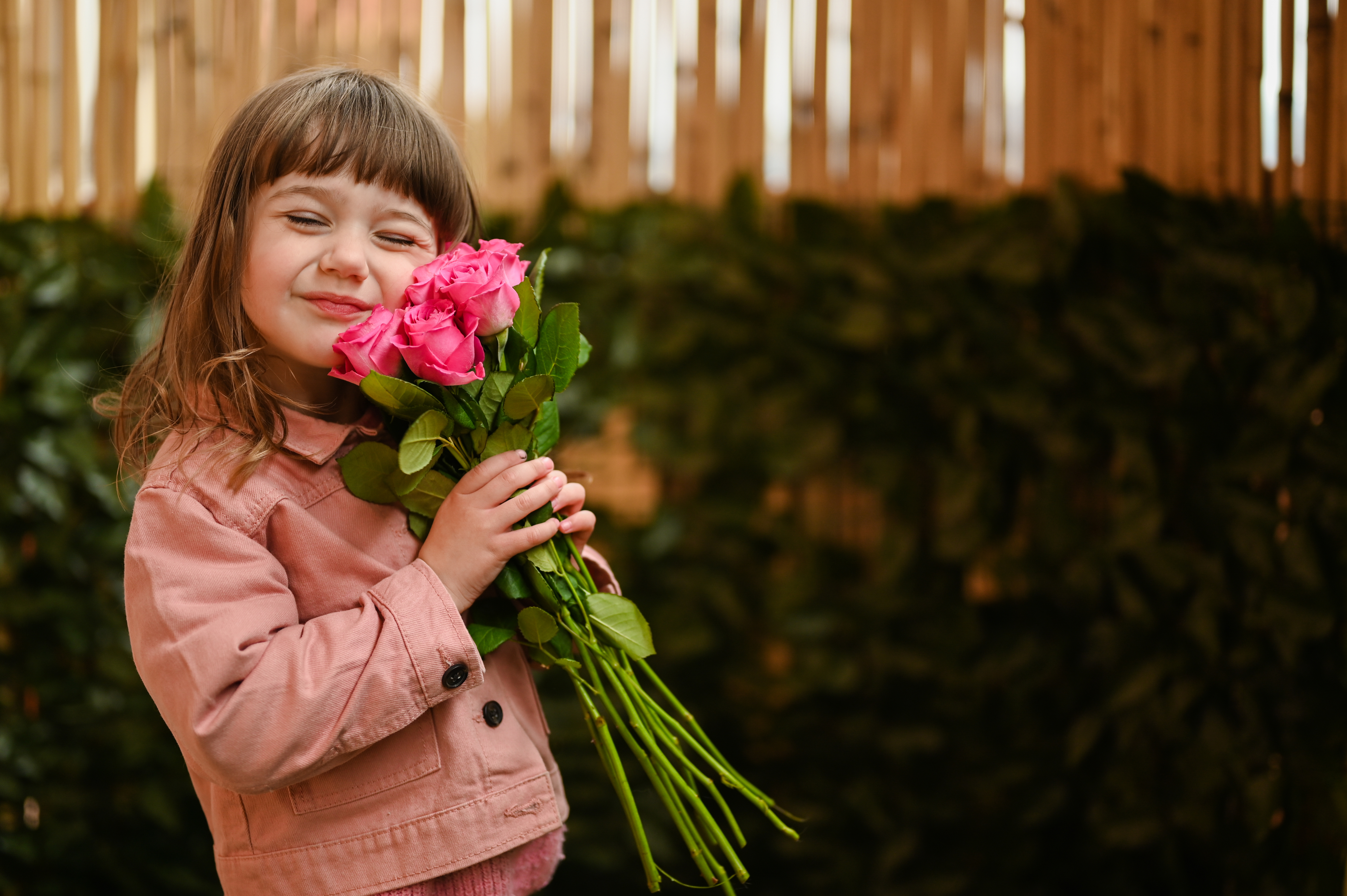 Portrait of little toddler girl in harmony with nature.Pretty toddler girl with flower bouquet for birthday mother s day. | Source: Getty Images