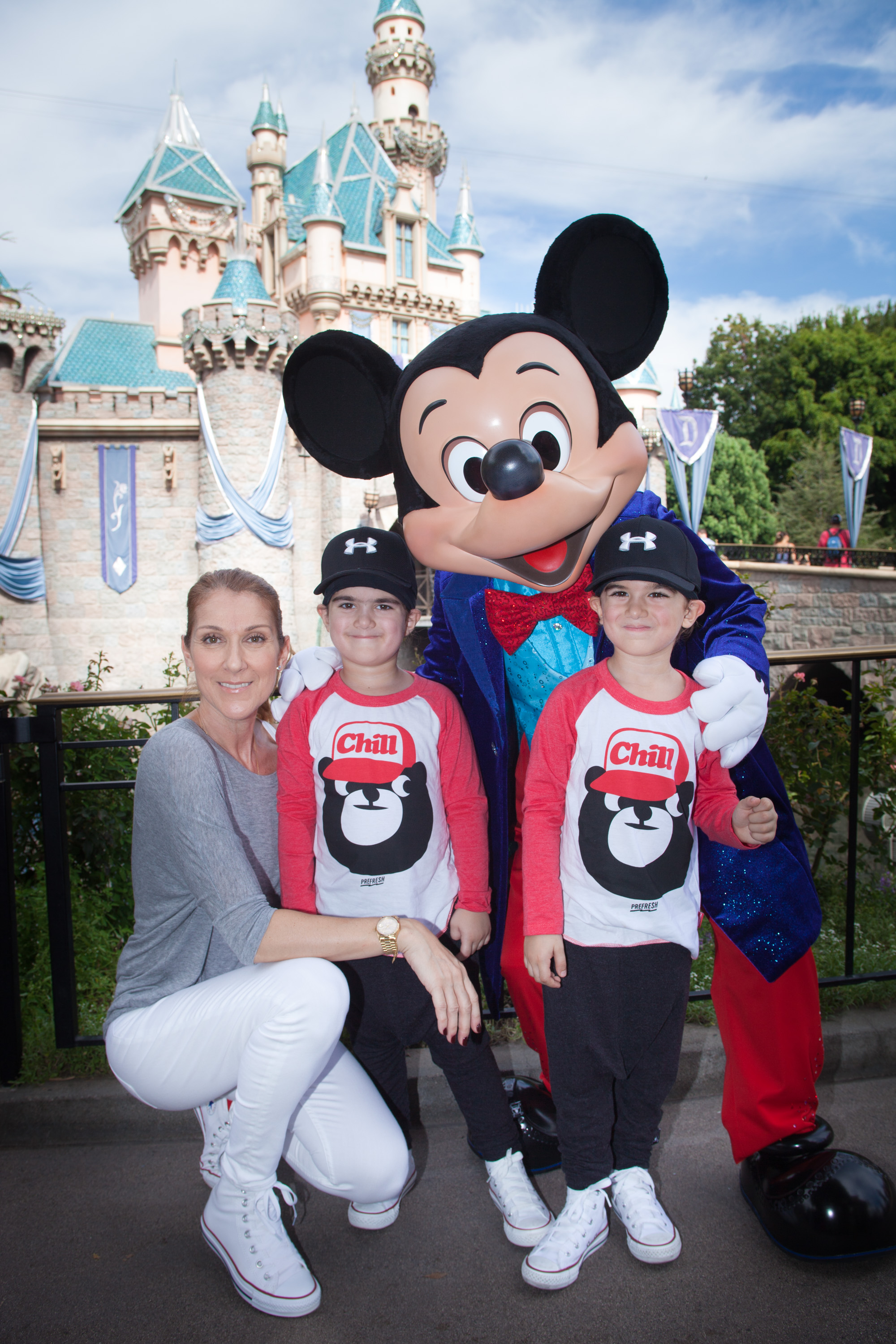 Celine Dion, Eddy, and Nelson Angelil celebrate the boys' upcoming fifth birthday with Mickey Mouse at Disneyland park in Anaheim, California, on October 14, 2015. | Source: Getty Images