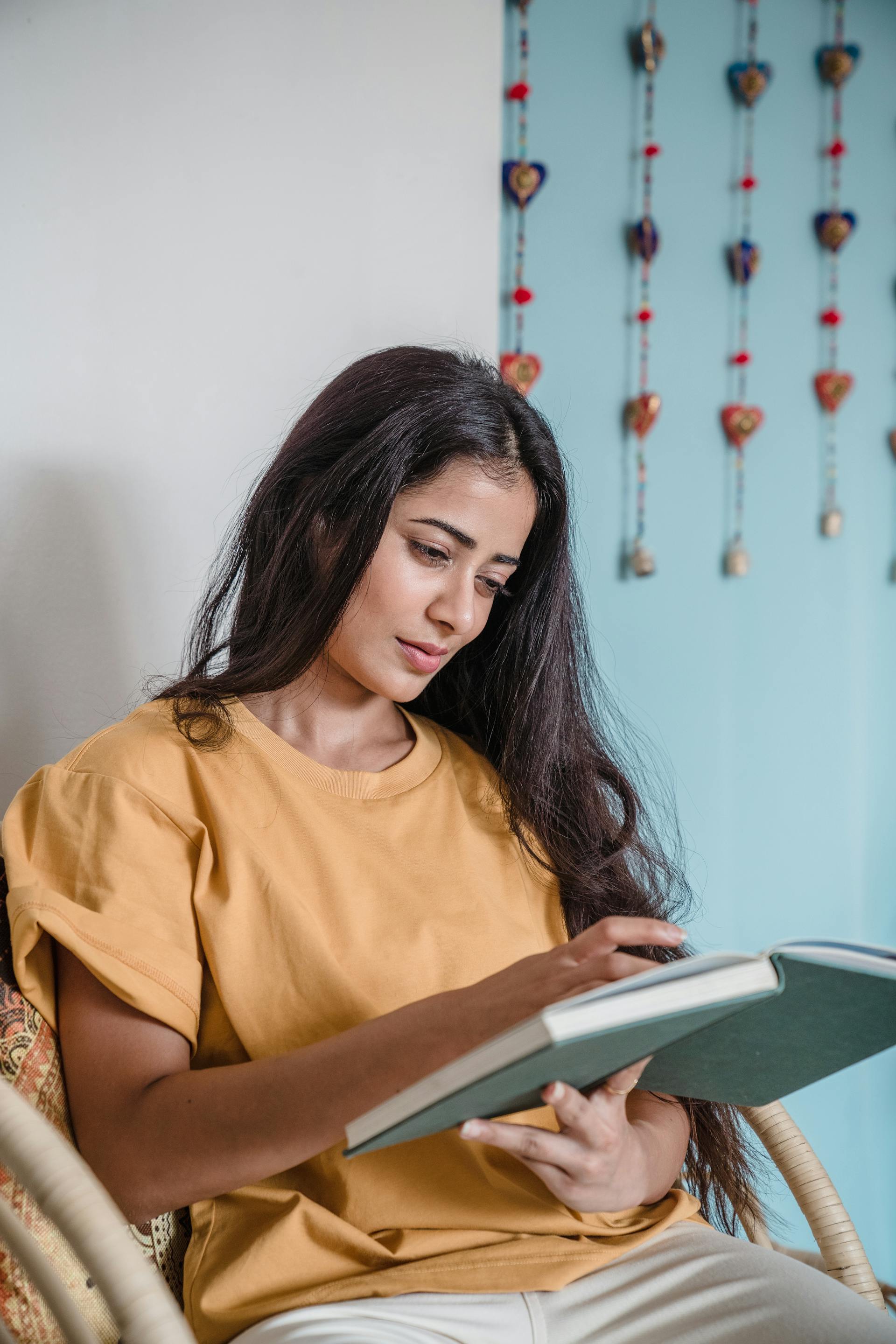 A woman paging through a book | Source: Pexels