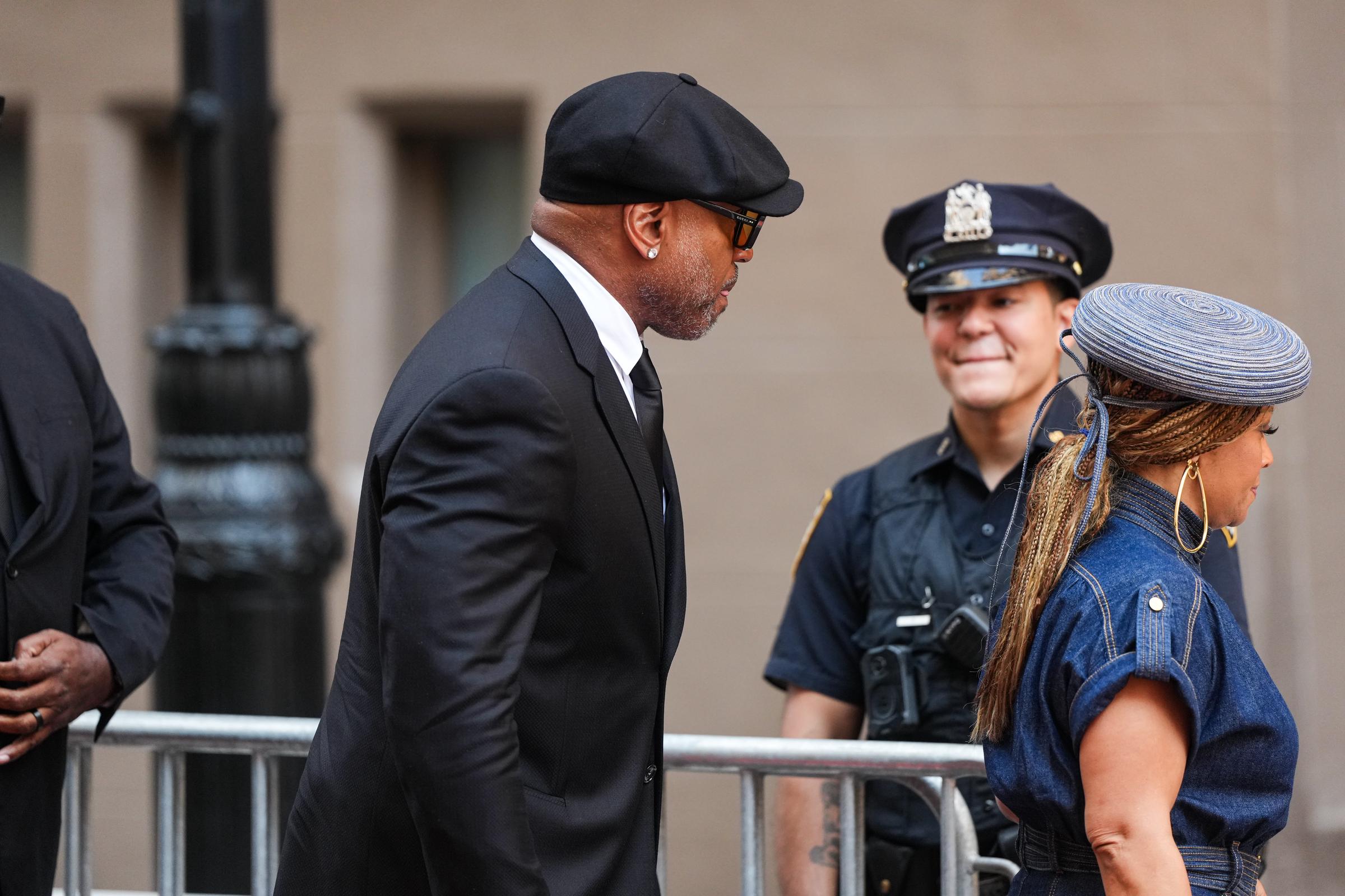 LL Cool J and his wife, Simone Smith, were among the many celebrities who gathered to pay their respects to Clive Davis in New York City. | Source: Getty Images