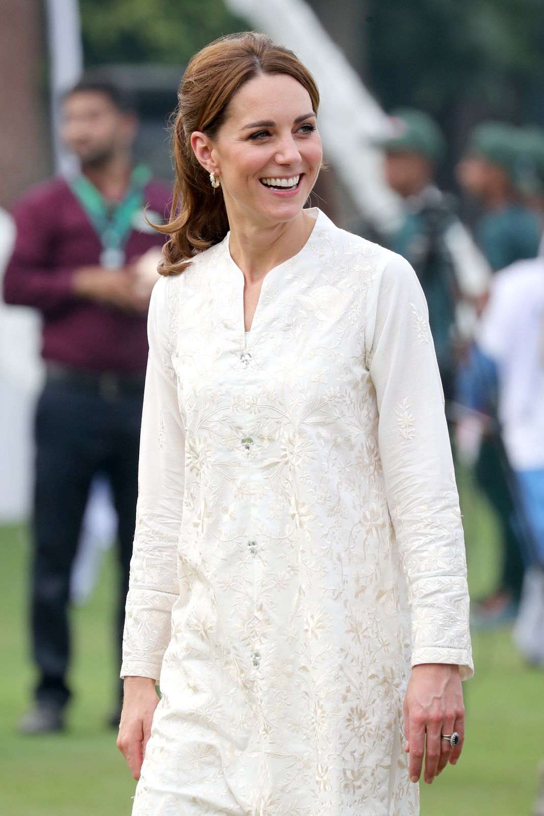 Kate Middleton Stuns in White Blouse & Maroon Jumper in Photo for Book