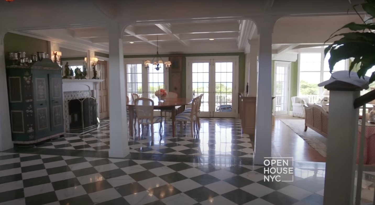 The spacious dining room with green and white floor marbles. | Source: Youtube.com/Open House TV